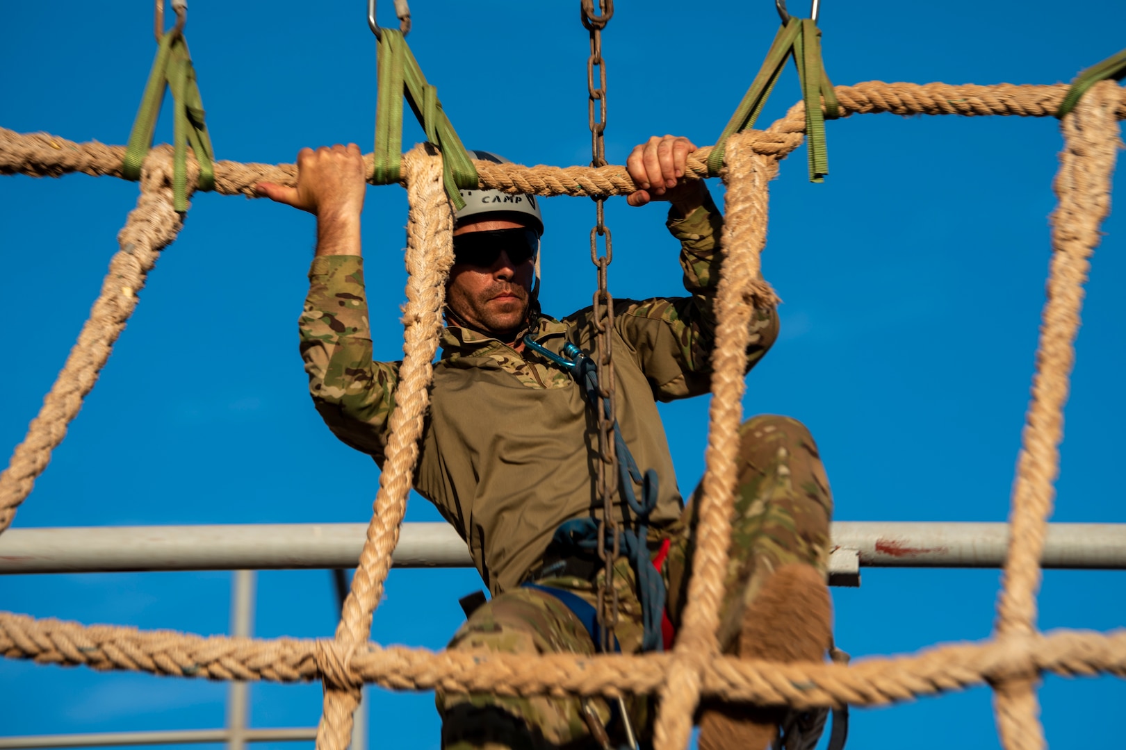 U.S. Air Force Tech. Sgt. Matthew O’Brien, an 82nd Expeditionary Rescue Squadron survival, evasion, resistance and escape specialist, climbs a rope during the French Desert Commando Course (FDCC) at Arta Range, Djibouti, April 26, 2022.