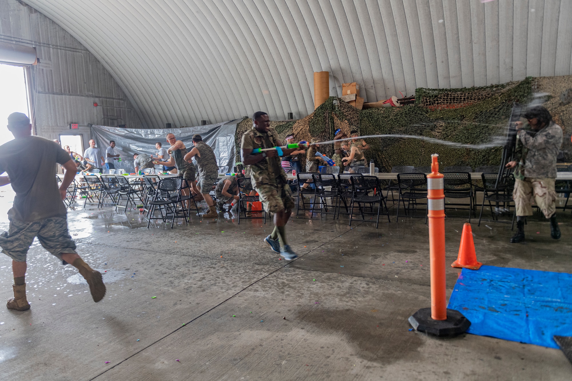 Photo of Airmen spraying each other with water guns