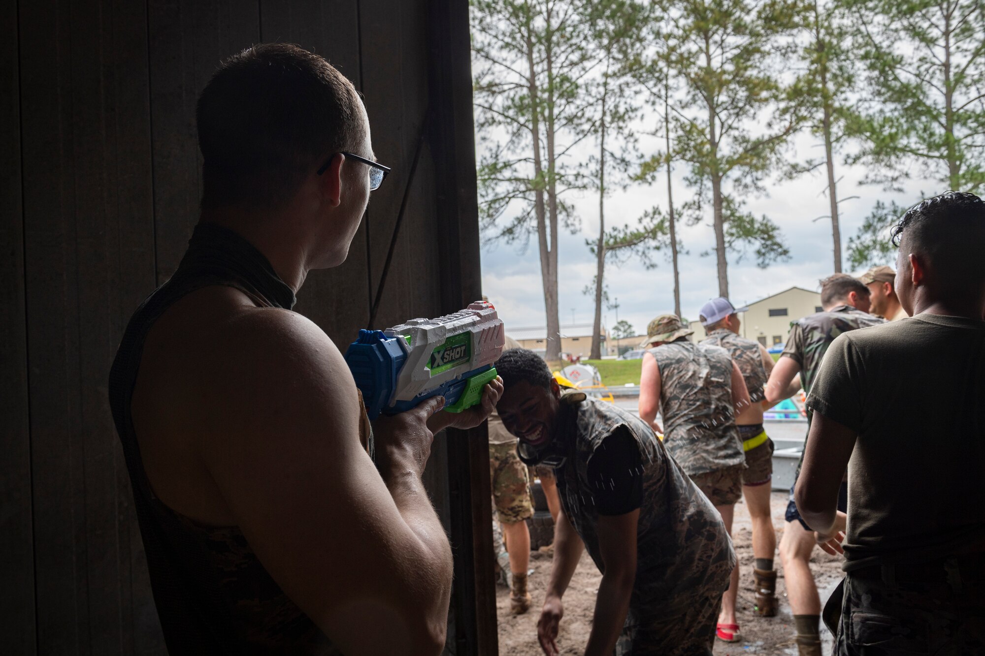 Photo of Airmen preparing to go through an obstacle course