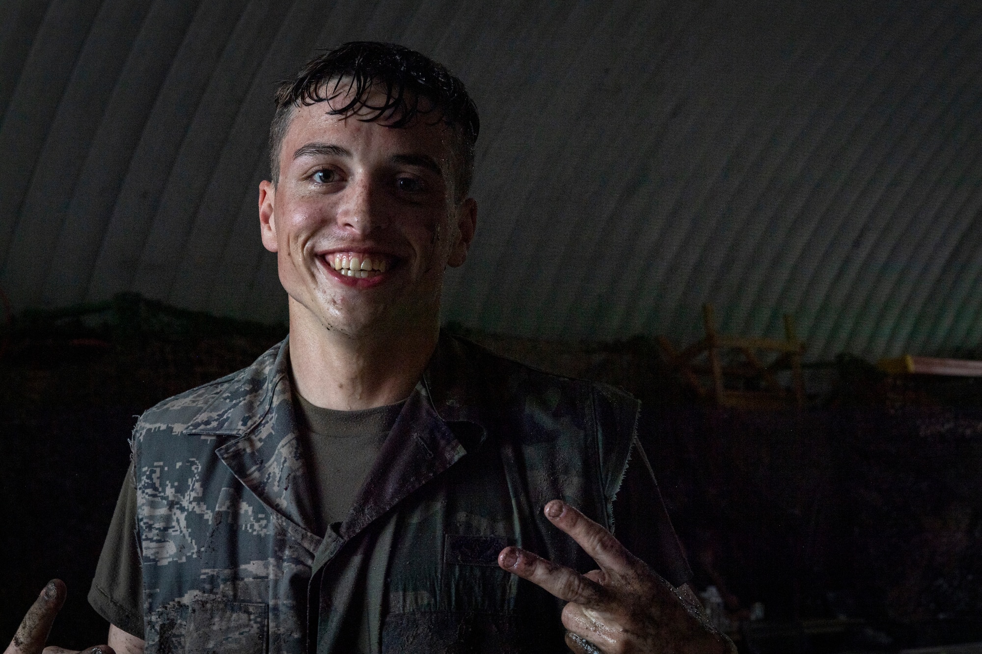 Photo of an Airman putting up a peace sign