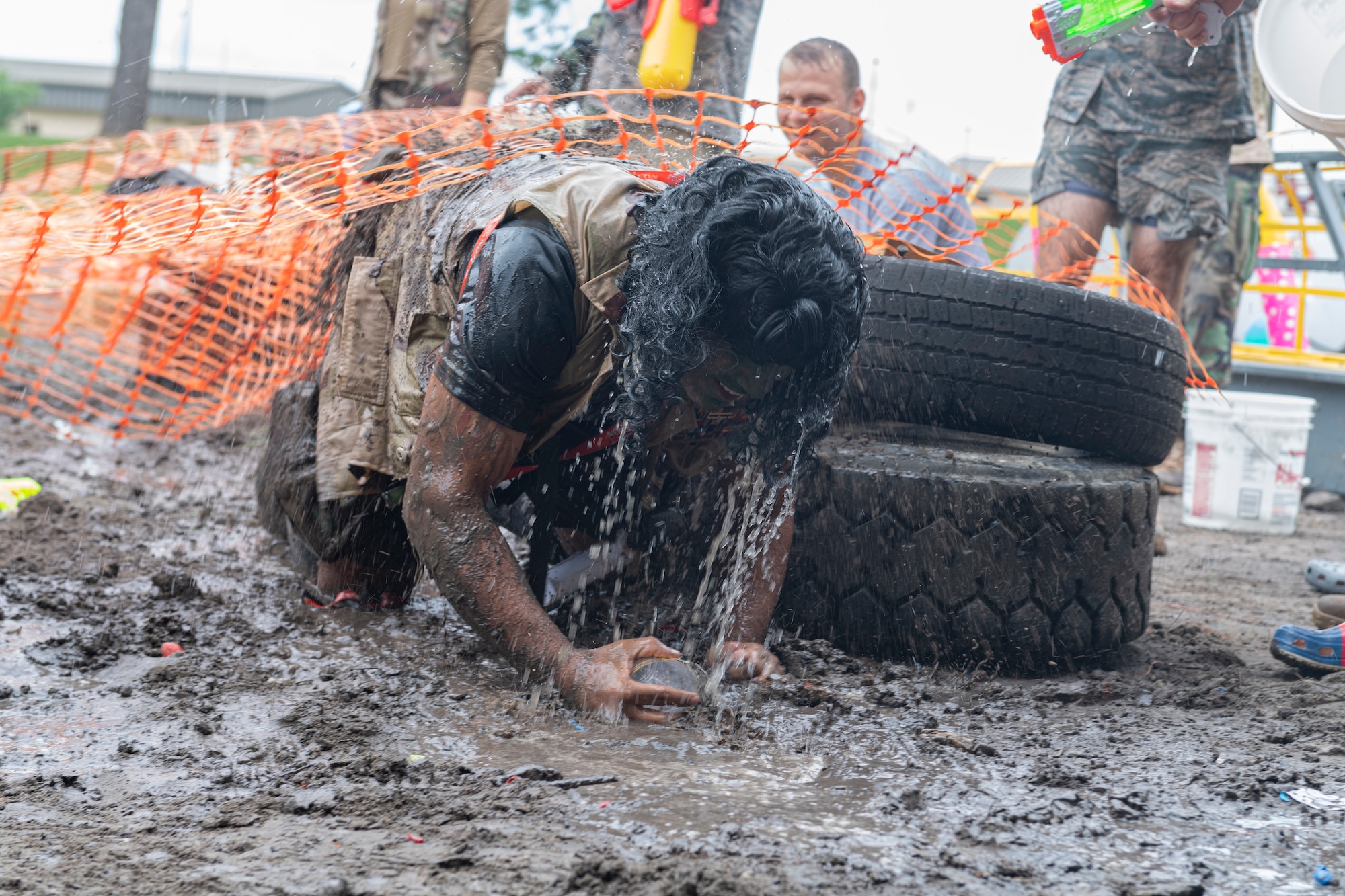 Photo of an Airman completing an obstacle course