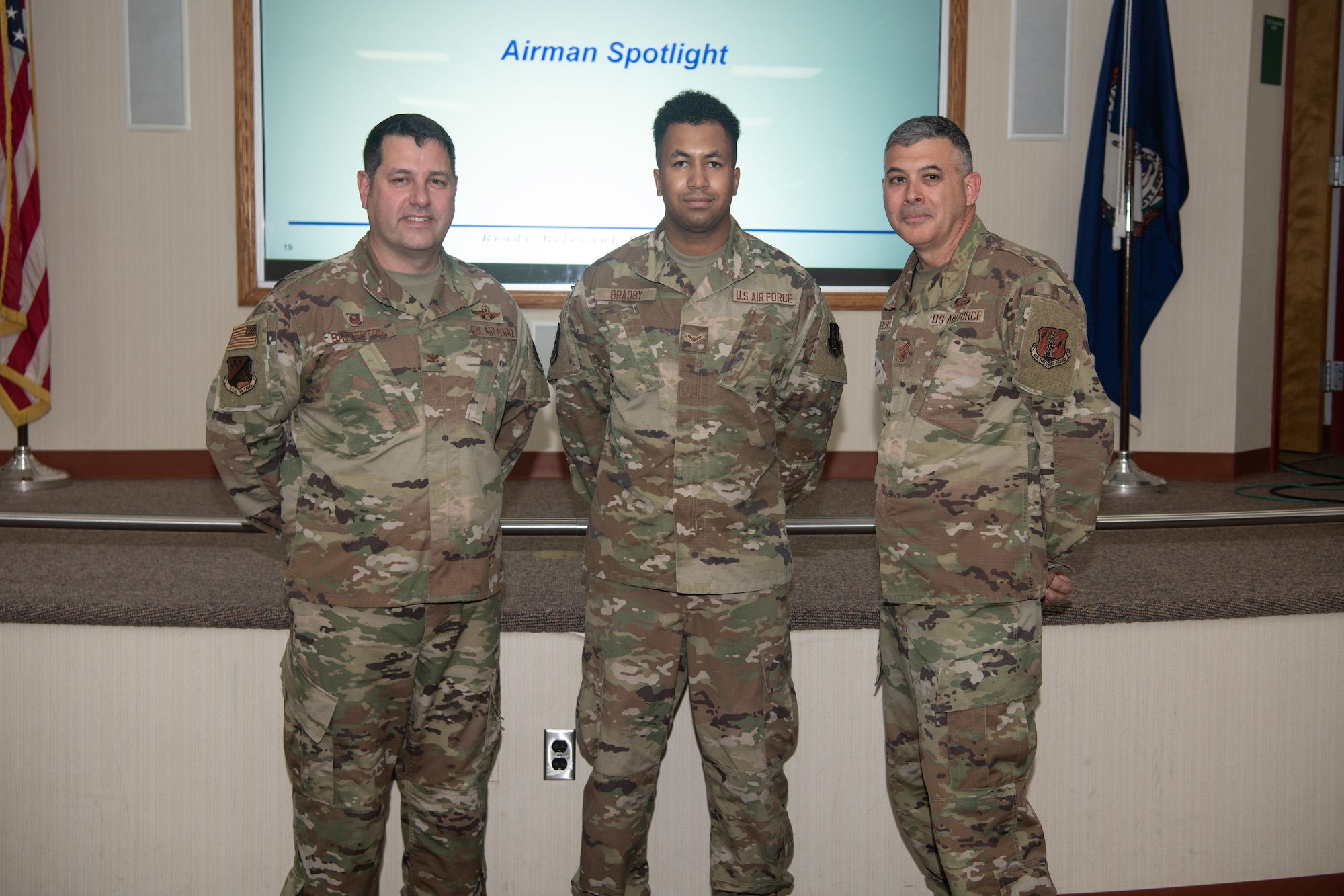 From left, Col. Christopher G. Batterton, 192nd Wing commander, Airman 1st Class Jesse Bradby, 203rd RED HORSE, and Chief Master Sgt. Richard Roberts, 192nd Wing command chief, pose for a photo.