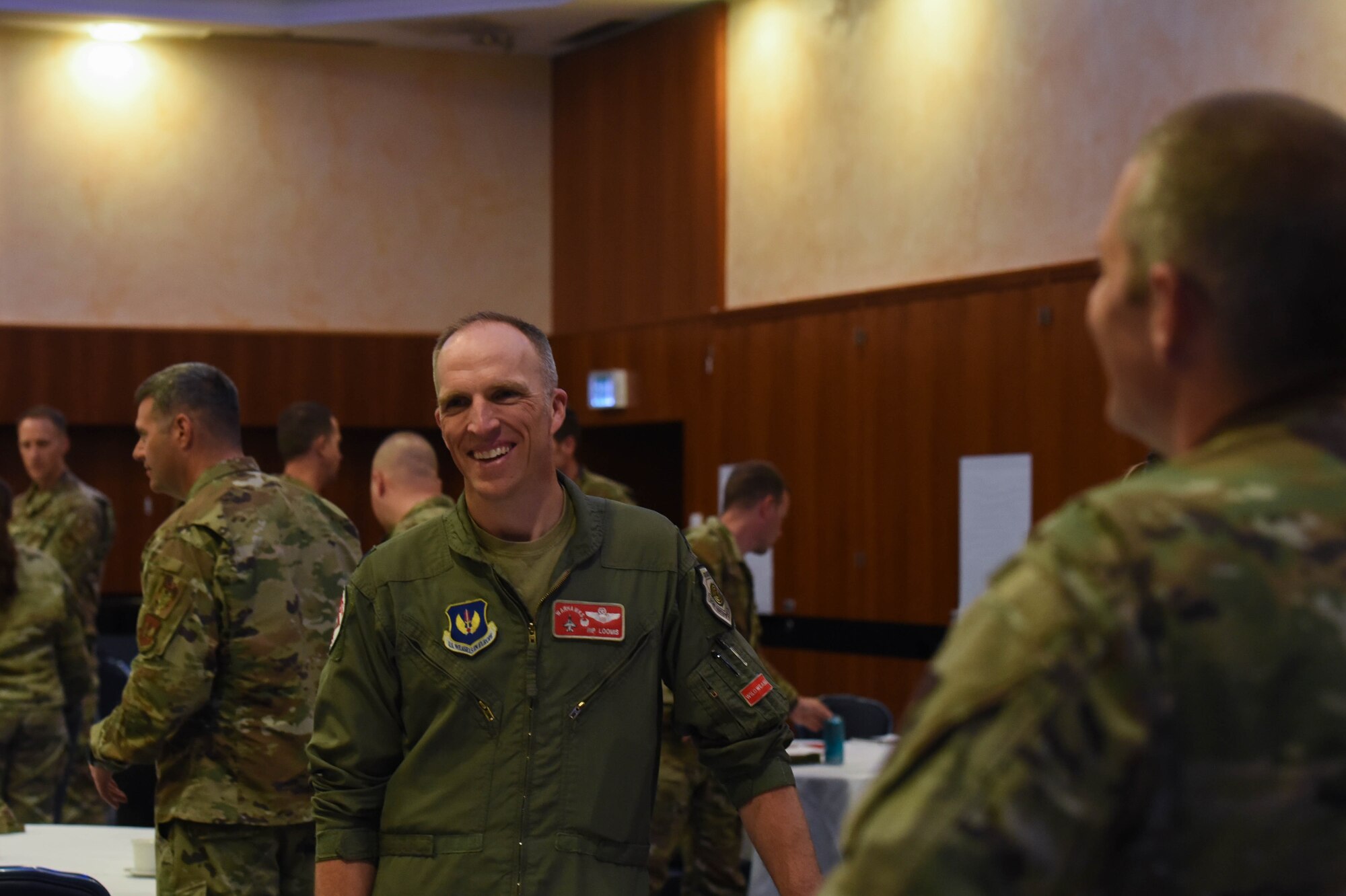 U.S. Air Force Lt. Col. Shaun Loomis, 480th Fighter Squadron commander, talks to his fellow service members during the Key Spouse Symposium, May 25, 2022, on Spangdahlem Air Base, Germany. Unit leaders attended the event to show support and unity within the Key Spouse Program.
(U.S. Air Force photo by Airman 1st Class Imani West)