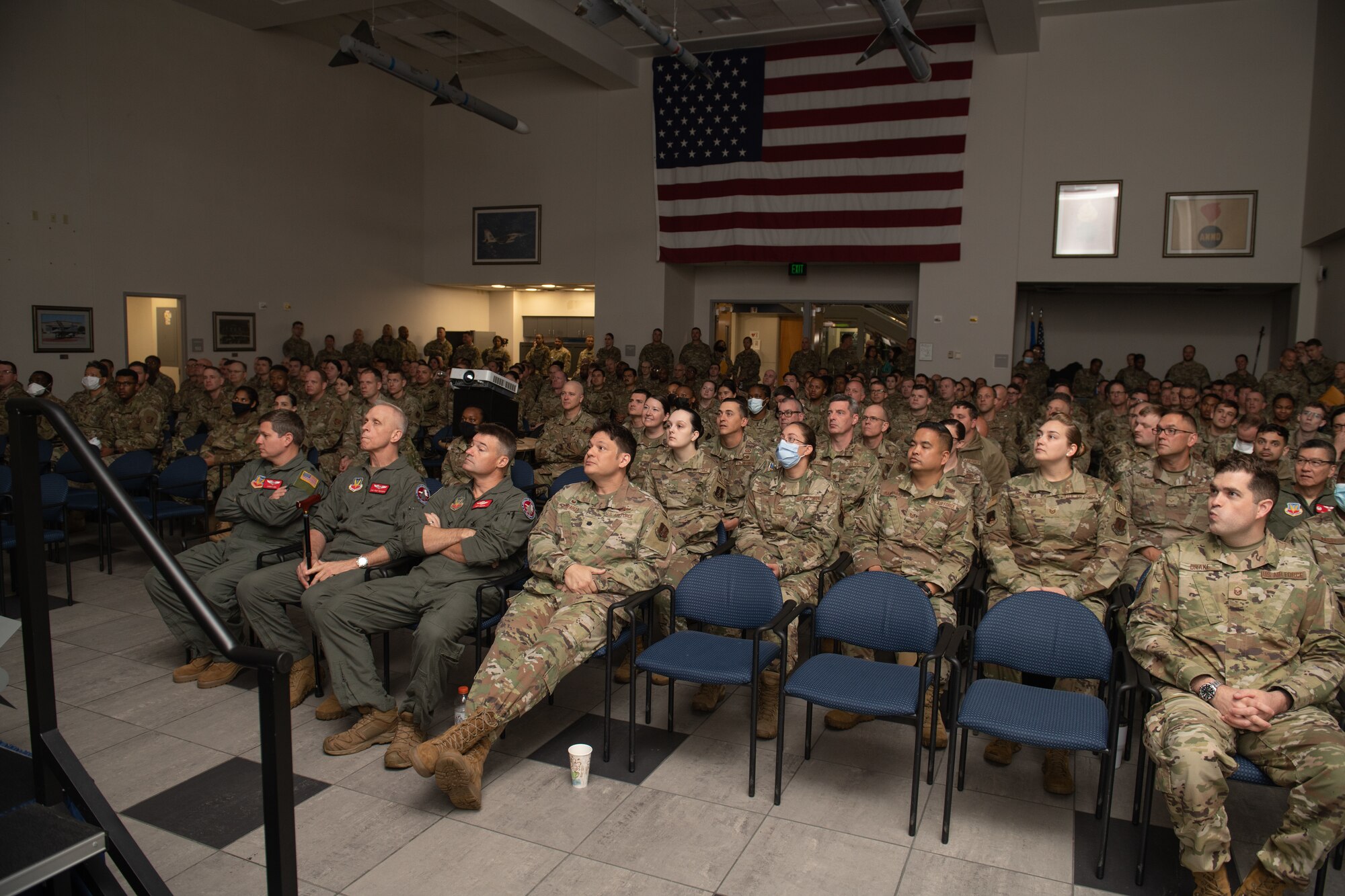 Airmen sit in the audience at an All Call.