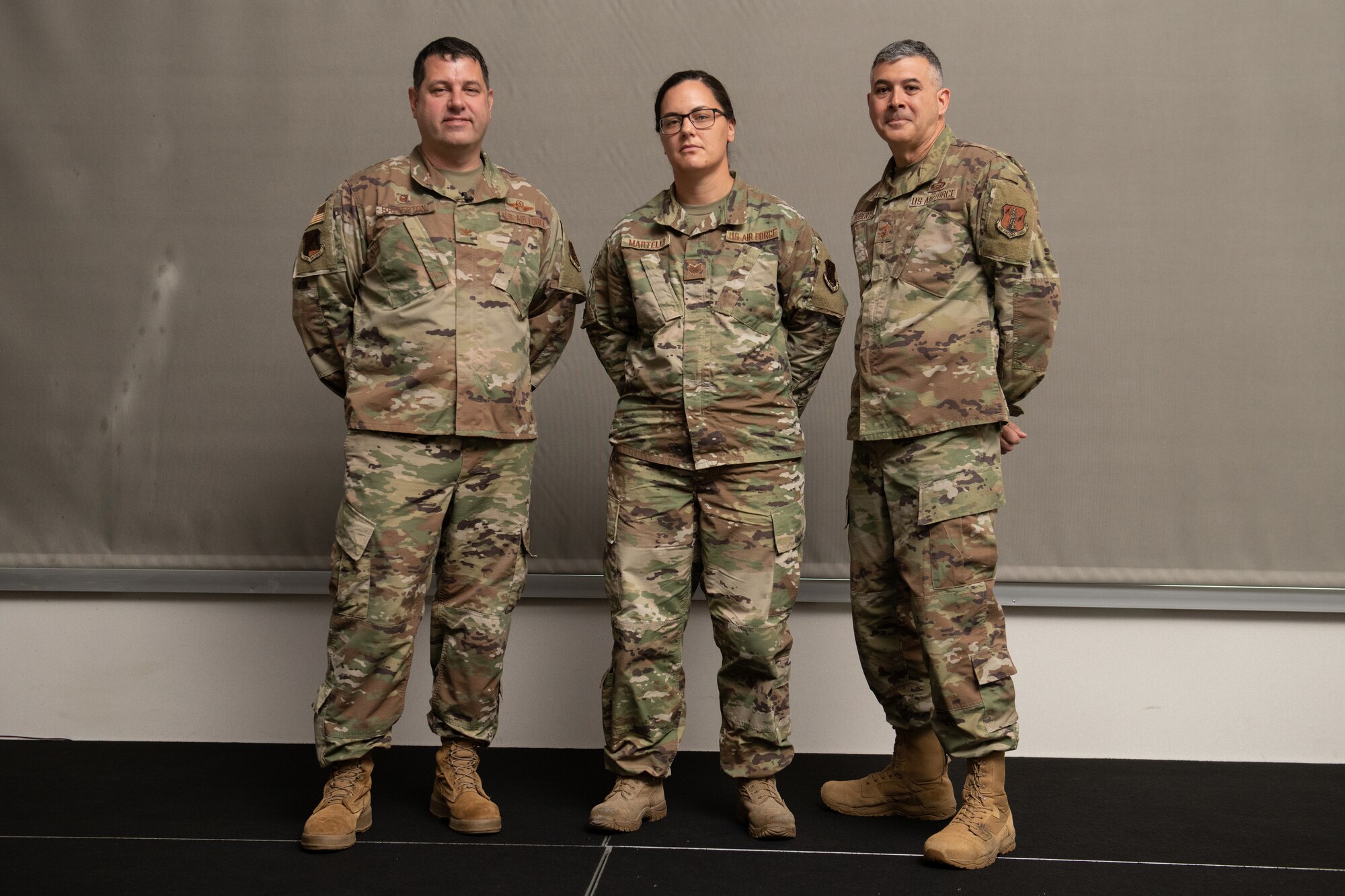 From left, Col. Christopher G. Batterton, 192nd Wing commander, Tech. Sgt. Katy Martello, 192nd Maintenance Squadron shift lead, and Chief Master Sgt. Richard Roberts, 192nd Wing command chief, pose for a photo.