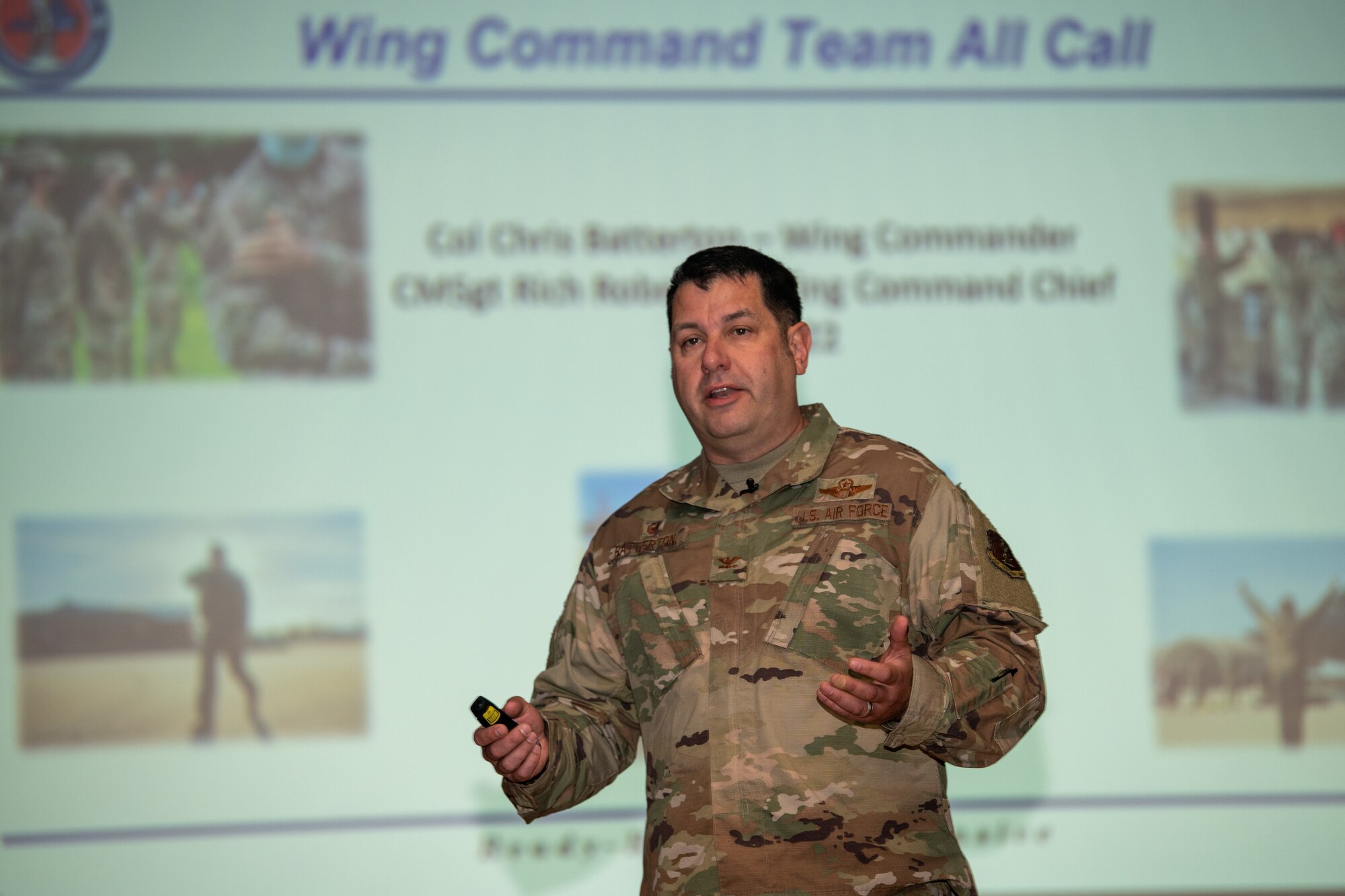 Col. Christopher G. Batterton, 192nd Wing commander, speaks on stage.