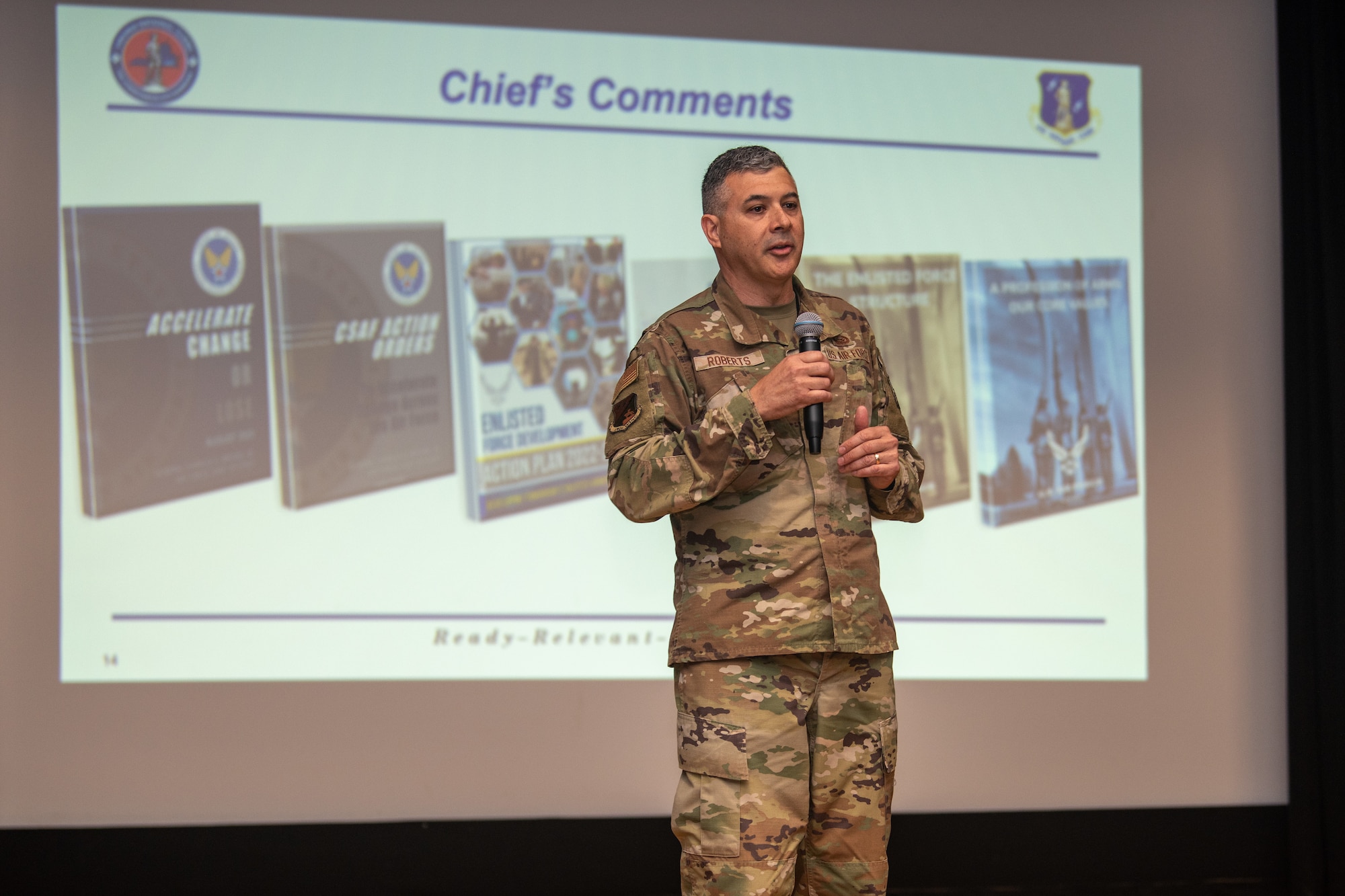 Chief Master Sgt. Richard Roberts, 192nd Wing command chief, speaks on stage.