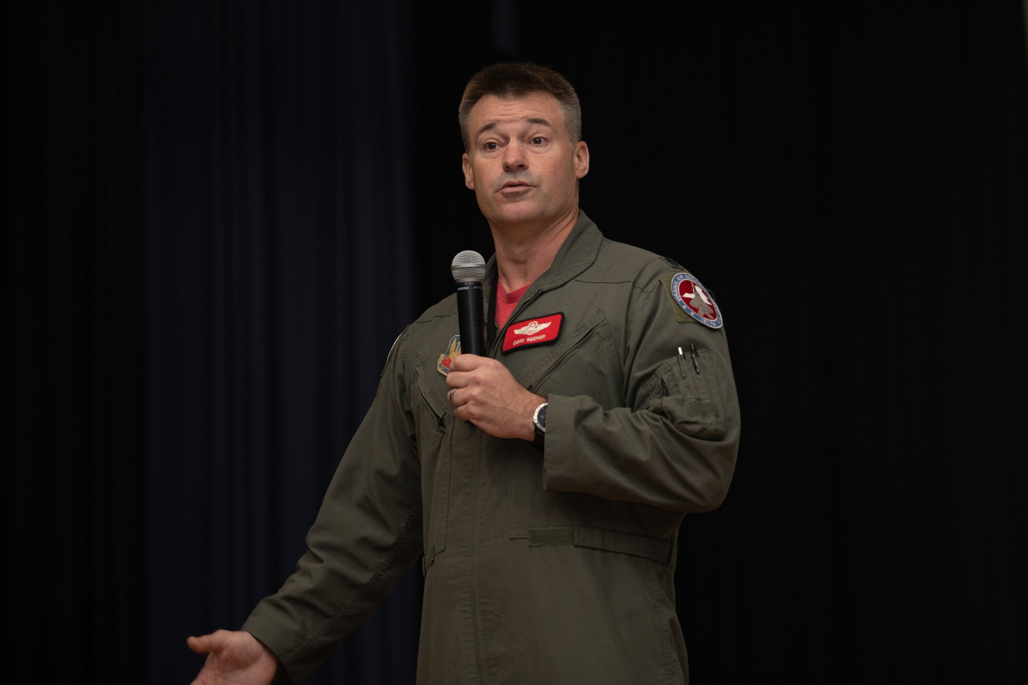 Lt. Col. Andrew Weidner, 192nd Operations Group deputy commander, speaks on stage.