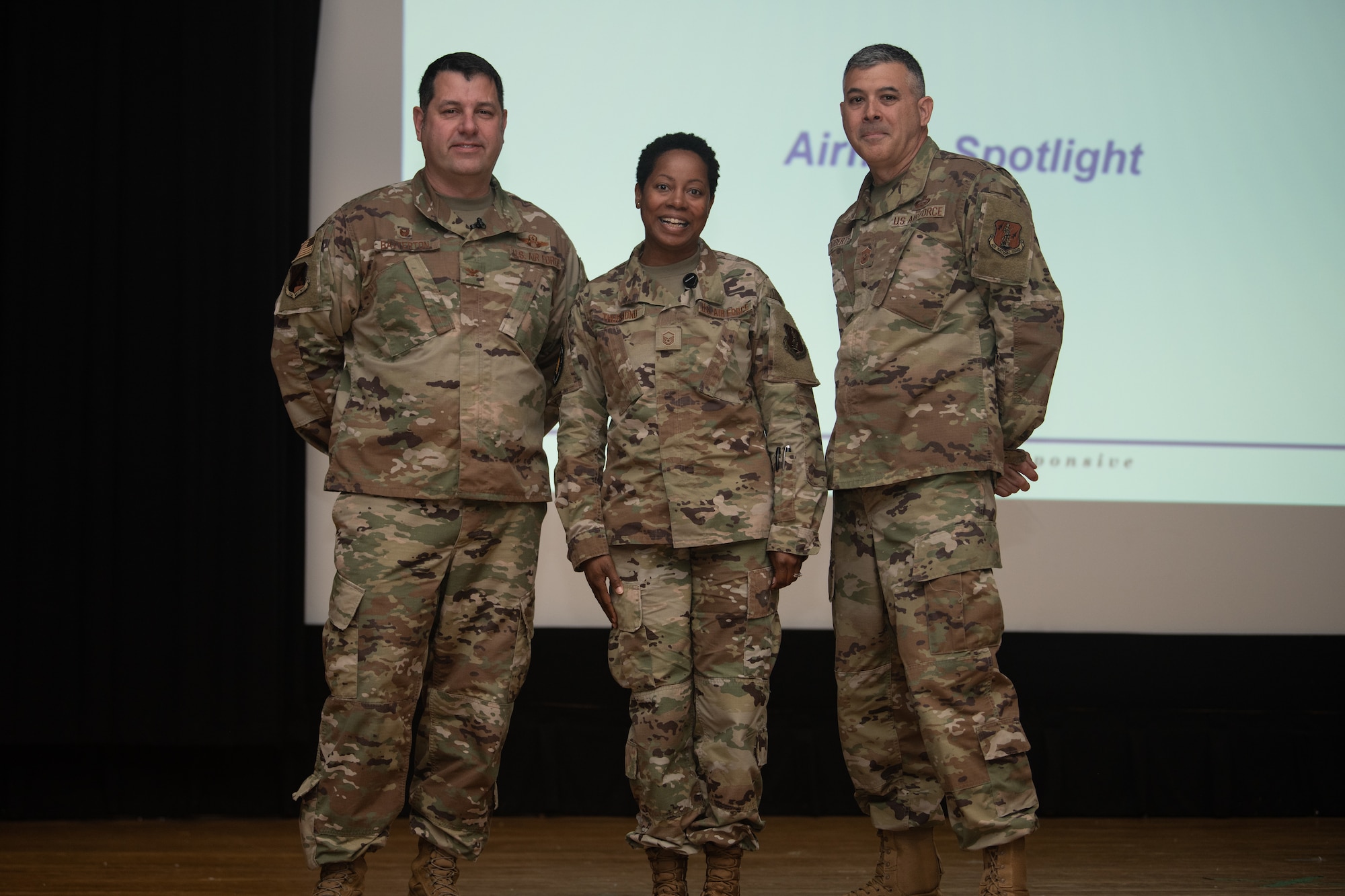From left, Col. Christopher G. Batterton, 192nd Wing commander, Master Sgt. Clarice Thurmond, 192nd Intelligence Squadron, and Chief Master Sgt. Richard Roberts, 192nd Wing command chief, pose for a photo.