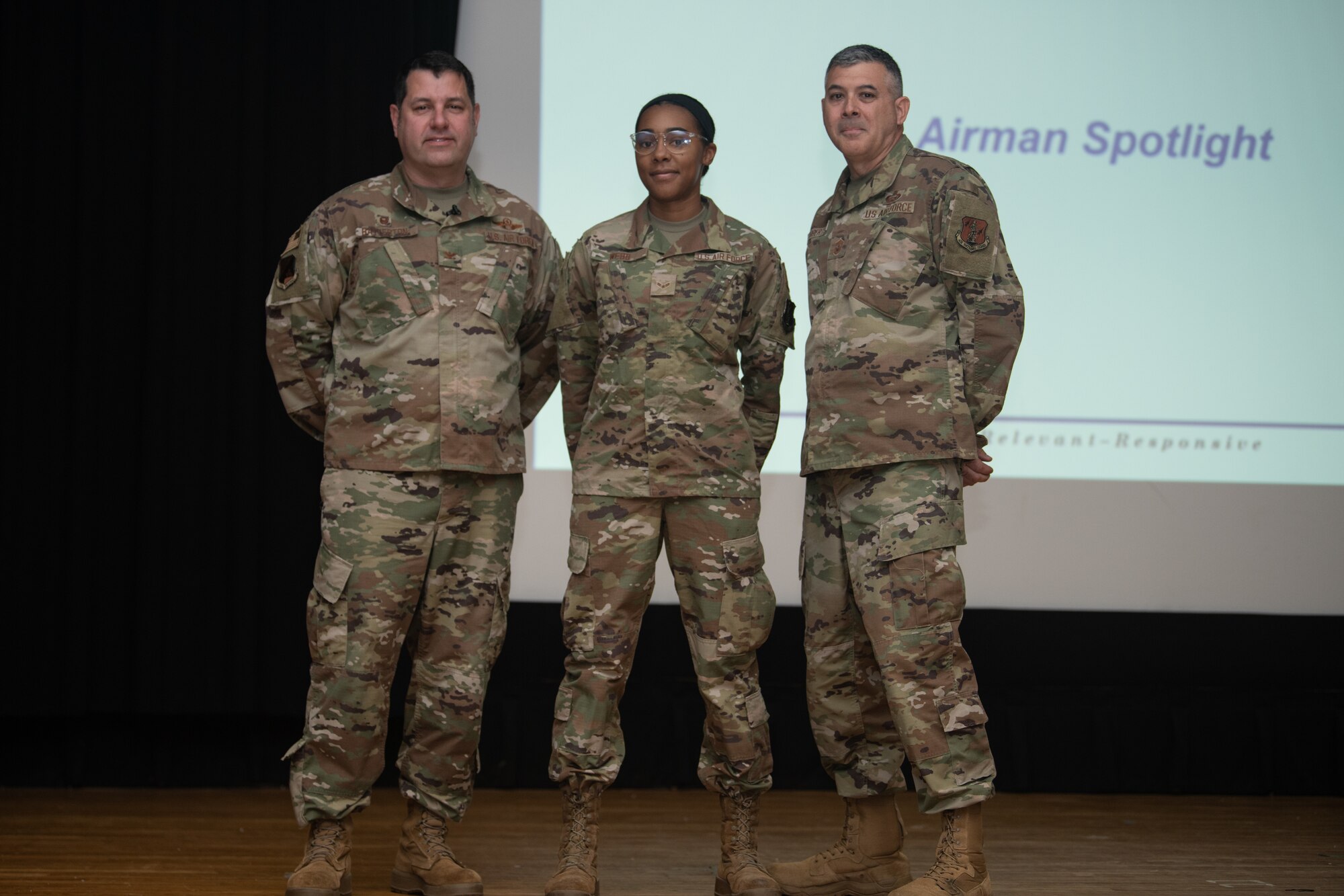 From left, Col. Christopher G. Batterton, 192nd Wing commander, Airman 1st Class Taylor Webb, 192nd Operations Support Squadron, and Chief Master Sgt. Richard Roberts, 192nd Wing command chief, pose for a photo.