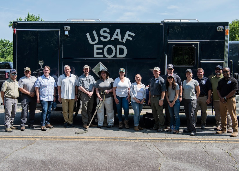 Personnel from the Department of Homeland Security pose for a group photo at the explosive ordnance disposal training range at Joint Base Andrews, Md., June 1, 2022.