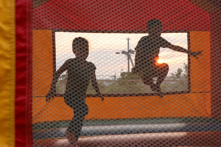Photo of children at play in a bouncy house.