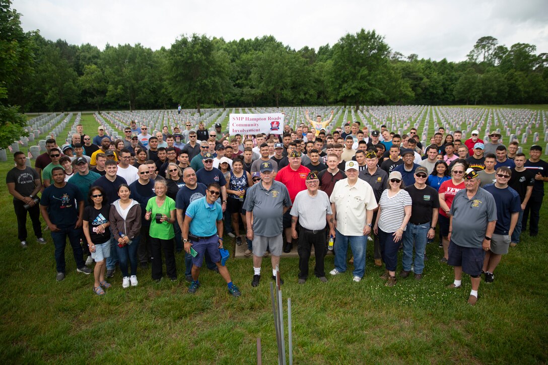 U.S. Marines with Fleet Marine Force, Atlantic, Marine Forces Command, Marine Forces Northern Command, Marine Aviation Support Detachment, Expeditionary Warfare Training Group Atlantic, Marine Corps Security Force Training Company, Northwest Annex and Veterans of Foreign Wars with the American Legion Auxiliary gather for a group photo at Albert G. Horton, Jr. Memorial Veterans Cemetery, Virginia, May 27, 2022. The Albert G. Horton, Jr. Memorial Veterans Cemetery, opened in 2004 as a resting place for more than 12,750 veterans and their family members. Memorial Day was officially established by Congress as a national observance in 1971. (U.S. Marine Corps photo by Lance Cpl. Jack Chen)