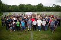 U.S. Marines with Fleet Marine Force, Atlantic, Marine Forces Command, Marine Forces Northern Command, Marine Aviation Support Detachment, Expeditionary Warfare Training Group Atlantic, Marine Corps Security Force Training Company, Northwest Annex and Veterans of Foreign Wars with the American Legion Auxiliary gather for a group photo at Albert G. Horton, Jr. Memorial Veterans Cemetery, Virginia, May 27, 2022. The Albert G. Horton, Jr. Memorial Veterans Cemetery, opened in 2004 as a resting place for more than 12,750 veterans and their family members. Memorial Day was officially established by Congress as a national observance in 1971. (U.S. Marine Corps photo by Lance Cpl. Jack Chen)