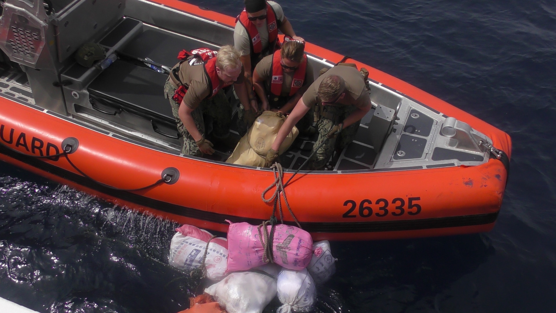 GULF OF OMAN (May 31, 2022) Personnel from U.S. Coast Guard fast response cutter USCGC Glen Harris (WPC 1144) recover bags of illegal narcotics discarded by a fishing vessel interdicted in the Gulf of Oman, May 31.