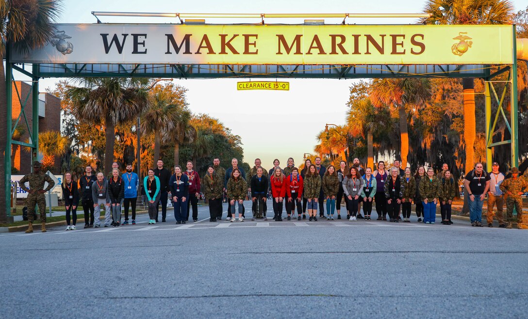 Educators and Influencers with Recruiting Station (RS) Lansing and RS Columbus post for a group photo on Marine Corps Recruit Depot (MCRD) Parris Island, S.C., February 10, 2022. Participants with RS Lansing and Columbus visited MCRD Parris Island for a four-day period to observe recruit training and gain a better understanding of how recruits are transformed into Marines. (U.S Marine Corps photo by Cpl. Jesse K. Carter-Powell)