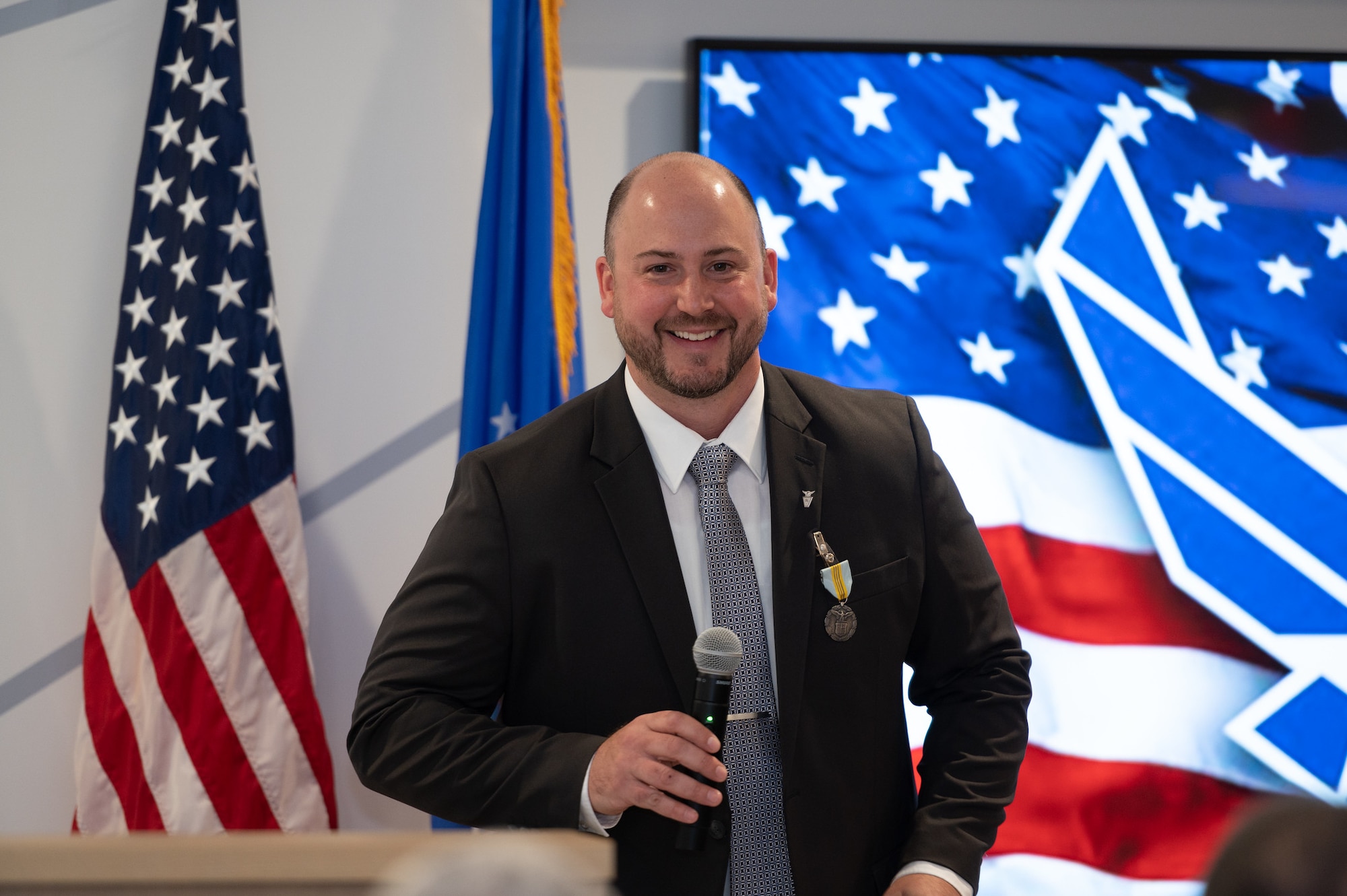 Brian Kropa, technical advisor, Advanced Cyber Technology, addresses attendees during his promotion ceremony to the senior level career service at the Hanscom Air Force Base, Mass., Collaborative Nerve Center May 6. During the ceremony, Kropa also received the Meritorious Civilian Service Award for his work as a chief engineer at Hanscom from September 2018 through March 2022.
