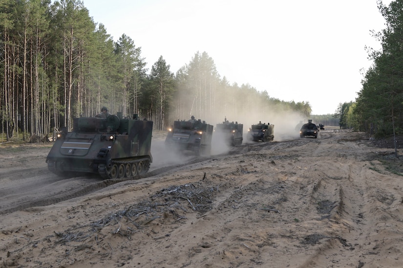 Soldiers with the 1st Battalion, 109th Field Artillery Regiment, 55th Maneuver Enhancement Brigade, 28th Infantry Division, Pennsylvania Army National Guard, drive M109A6 Paladins, M992A2 Field Artillery Ammunition Supply Vehicles, and M572 Armored Mortar Carriers from the Army Prepositioned Stock (APS) area to their cantonment area May 10, in Pabrade, Lithuania. The Soldiers are deployed to Lithuania in support of Defender Europe 22 and NATO exercise Flaming Thunder.