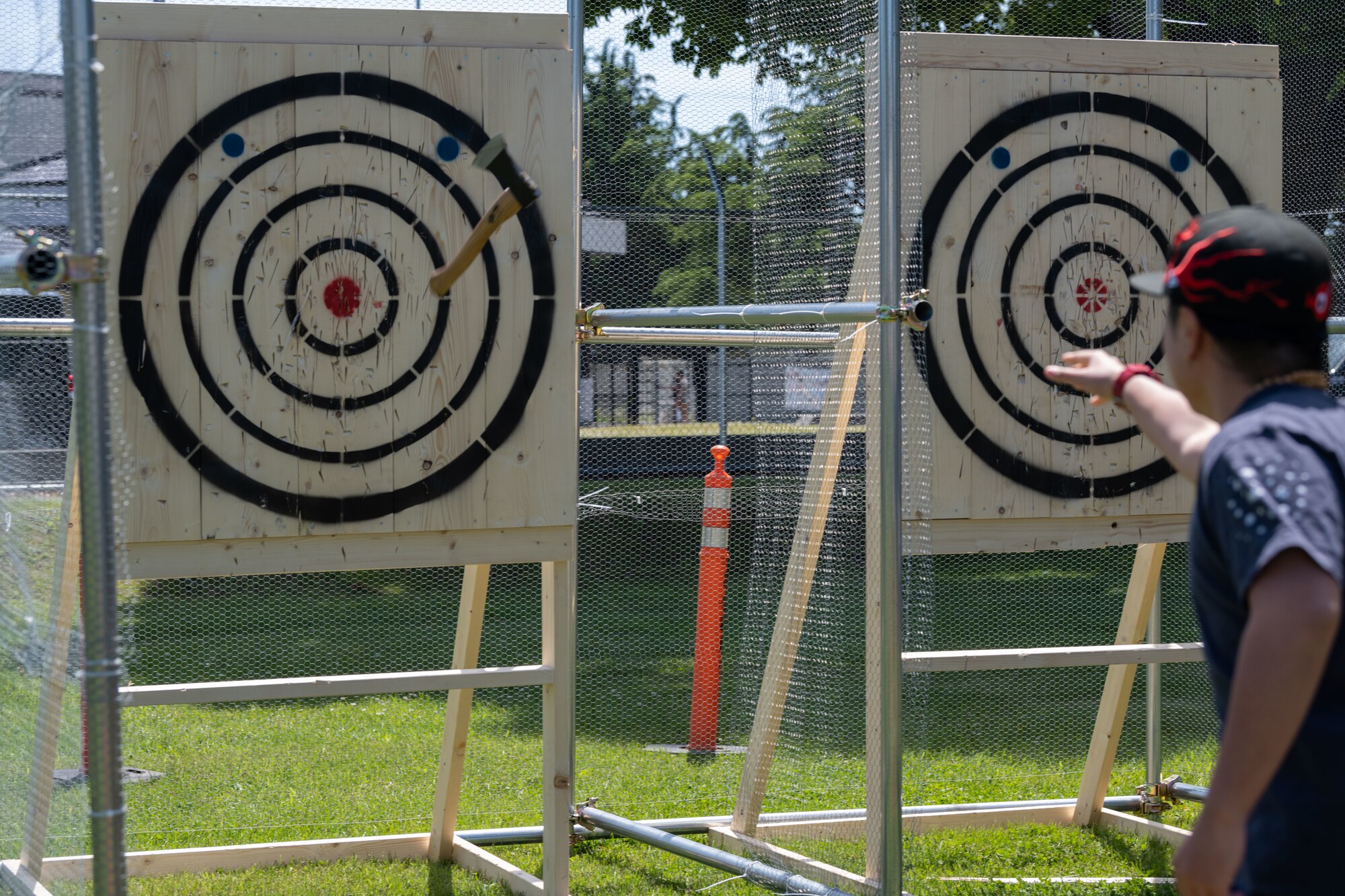 A Team Misawa member throws their axe at their target.