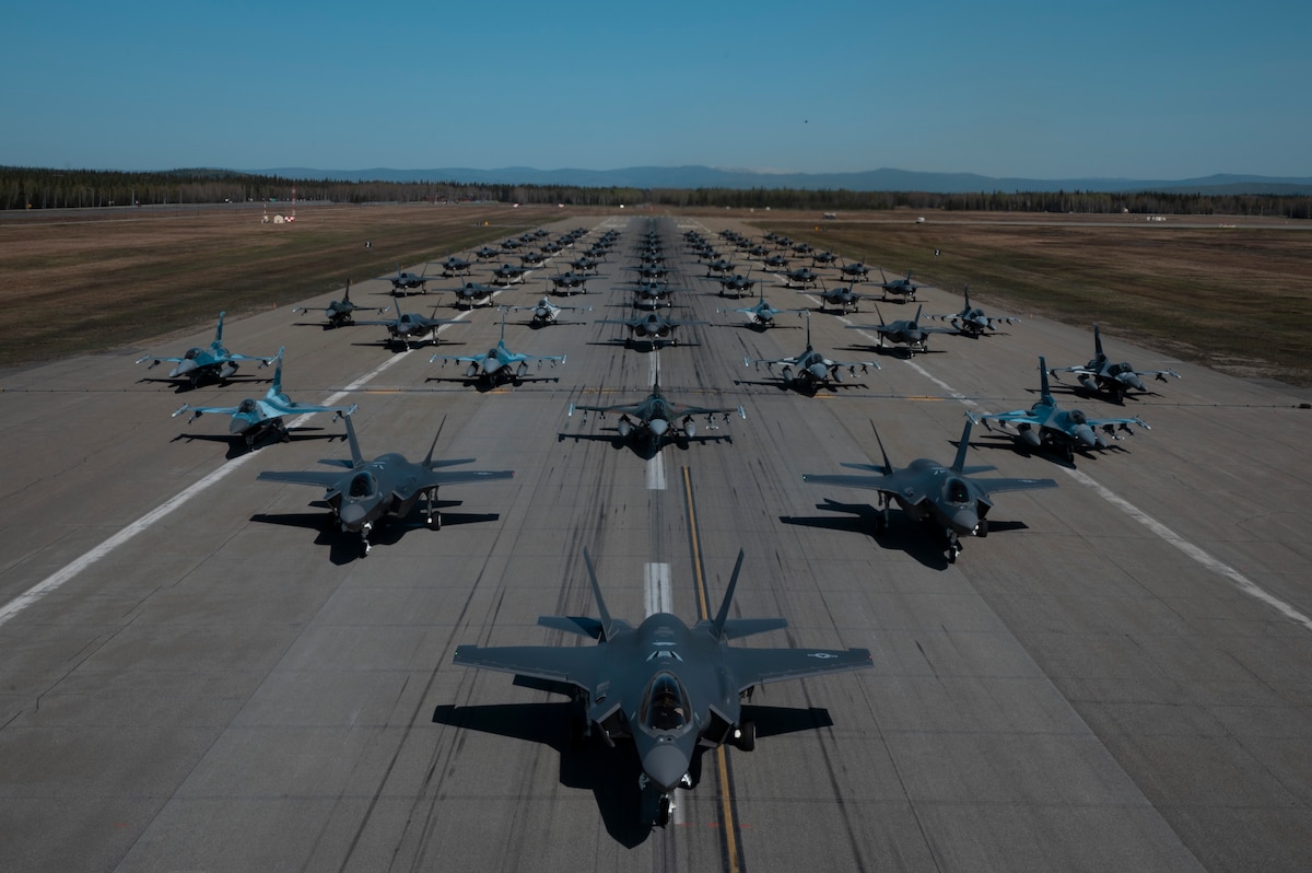 A formation of F-35A Lightning IIs and F-16 Fighting Falcons assigned to the 354th Fighter Wing assemble during a routine readiness exercise at Eielson Air Force Base, Alaska, May 20, 2022. The formation demonstrated the 354th FW's ability to rapidly mobilize and launch aircraft from its strategic arctic location. (U.S. Air Force photo by Airman 1st Class Elizabeth Schoubroek)