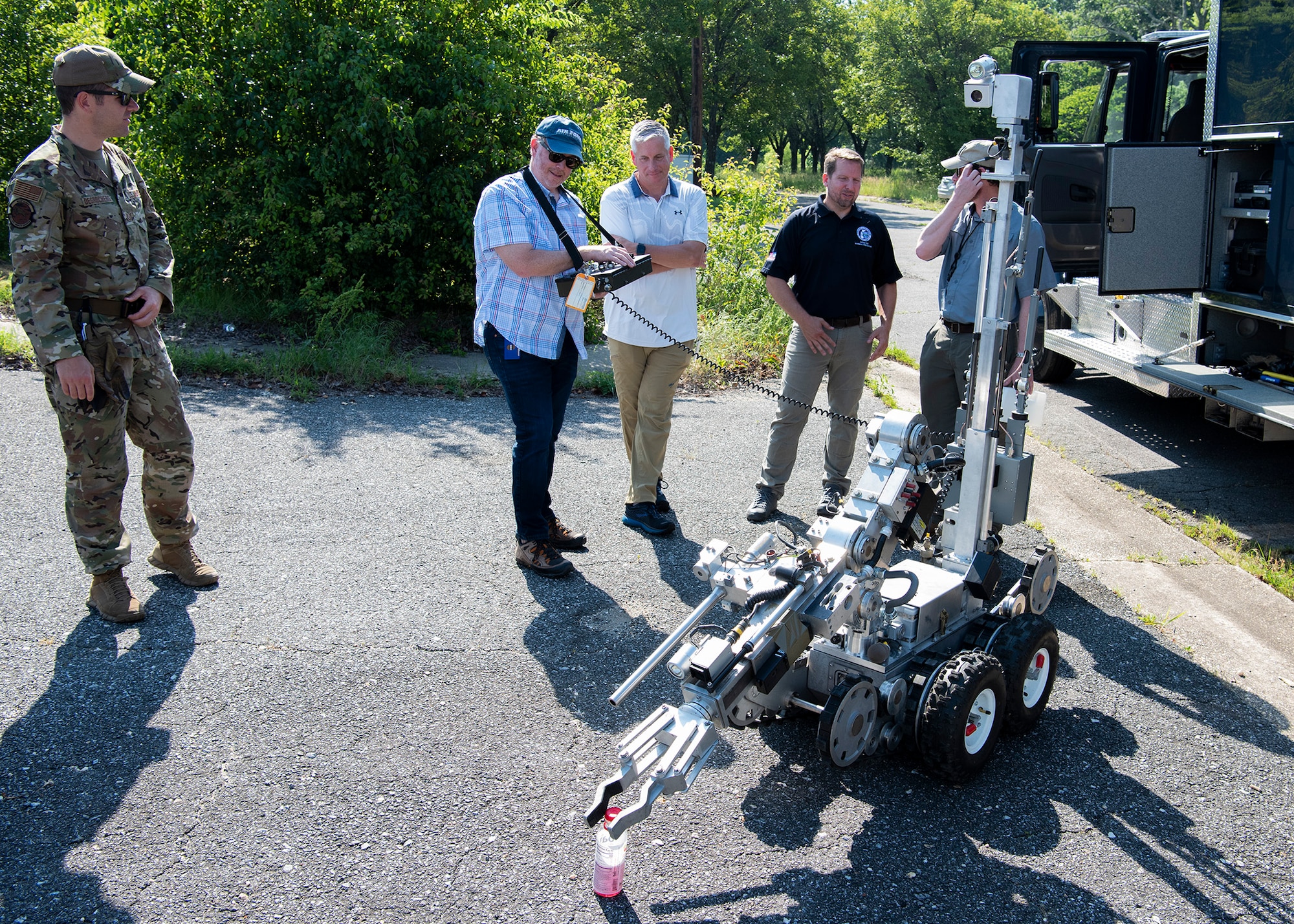 Personnel from the Department of Homeland Security pose for a group photo at the explosive ordnance disposal training range at Joint Base Andrews, Md., June 1, 2022.