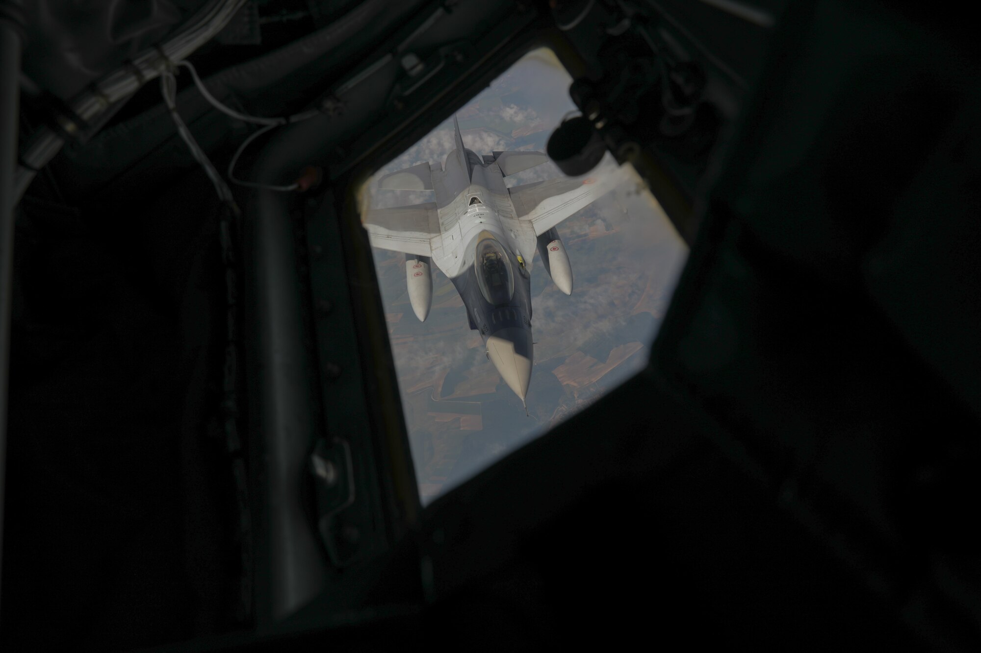 A Romanian F-16 prepares to be refueled in the air by a KC-135 from the Alabama Air National Guard 117th Air Refueling Wing in Bucharest, Romania. May 17, 2022. This exercise was part of a joint training mission through the State Partnership Program between the Alabama National Guard and Romania.