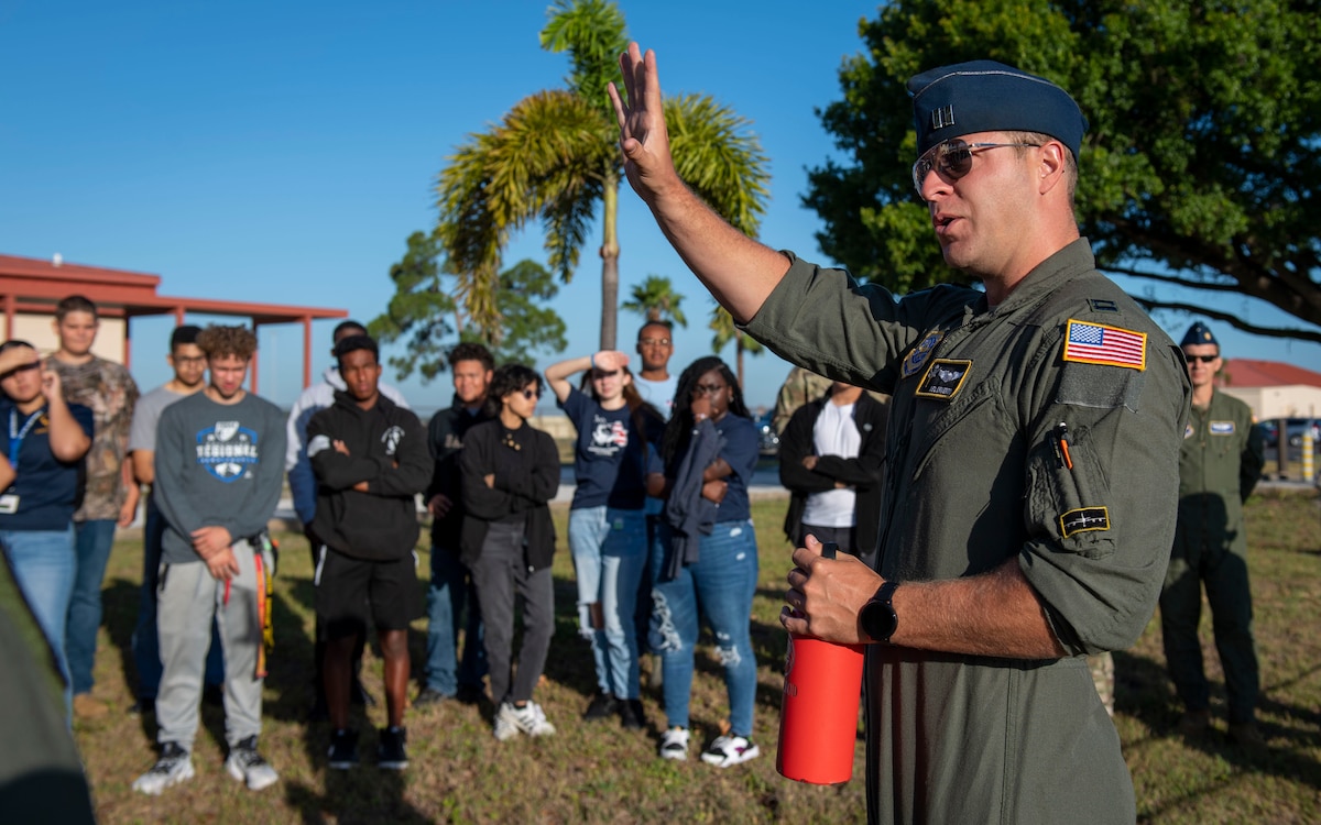 U.S. Air Force Capt. Neil Ormerod, an instructor pilot assigned to the 91st Air Refueling Squadron, speaks to a group of U.S. Air Force ROTC cadets from Osceola, Somner and Jefferson High School at MacDill Air Force Base, Florida, June 1, 2022. The students were invited to fly and tour the base as part of the Air Force Recruiting Service’s Aviation Inspired Mentorship program. (U.S. Air Force photo by Airman 1st Class Lauren Cobin)