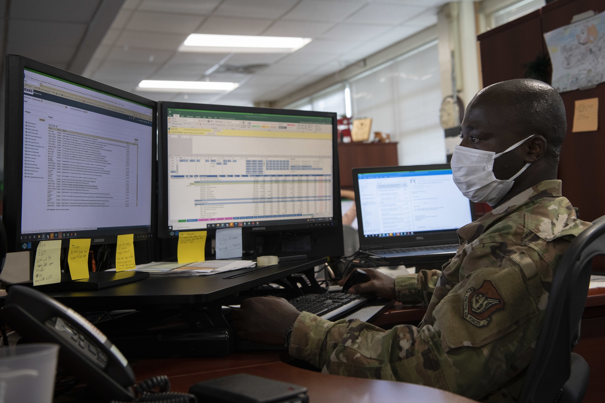 U.S. Air Force Staff Sgt. Emmanuel Agyemang Duah, 18th Comptroller Squadron travel team lead, works in the 18th CPTS financial analysis office at Kadena Air Base, Japan, May 17, 2022. The financial management office won the FY 2021 PACAF FMA of the year award. (U.S. Air Force photo by Staff Sgt. Rhett Isbell)