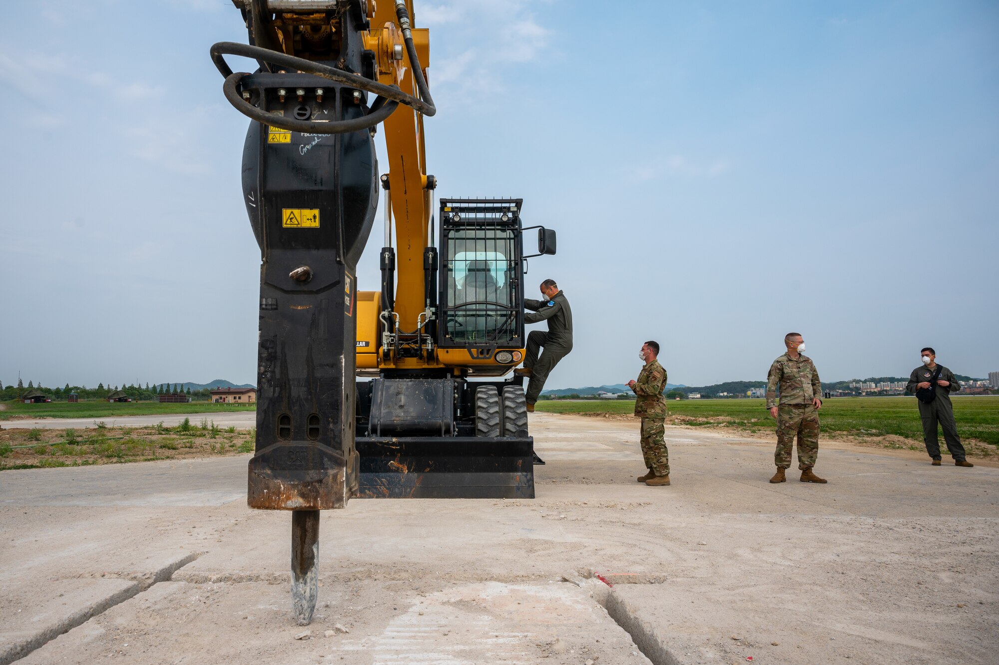 Lt. Gen. Scott Pleus, Seventh Air Force commander, sits in a up-armored loader