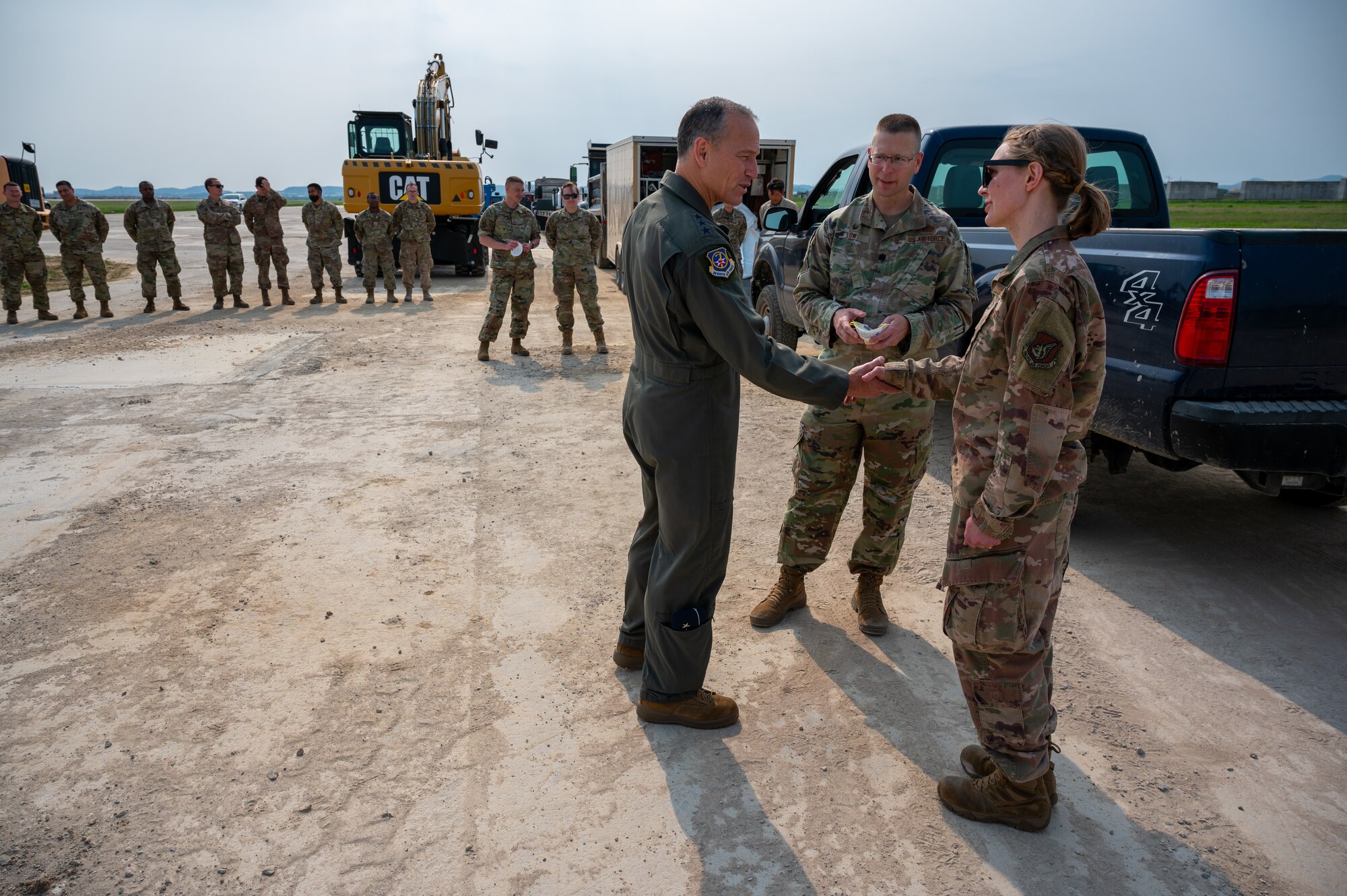 Lt. Gen. Scott Pleus, Seventh Air Force commander, sits in a up-armored loader