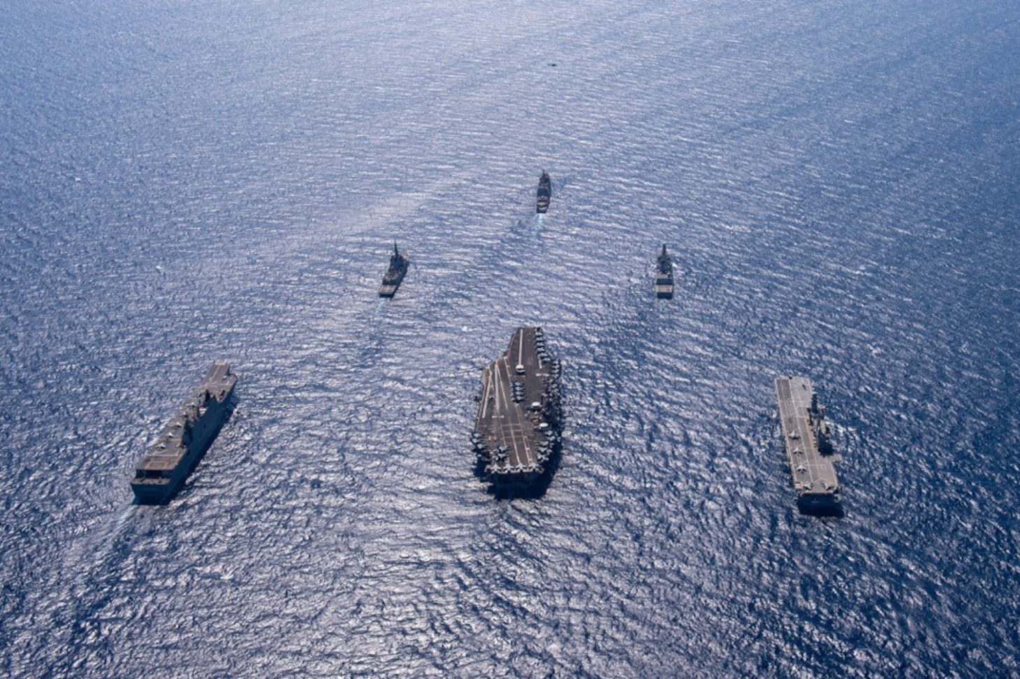 ADRIATIC SEA (May 31, 2022) The Nimitz-class aircraft carrier USS Harry S. Truman (CVN 75), back center, transits in formation with, from left to right, Spanish Navy multi-purpose amphibious assault ship-aircraft carrier ESPS Juan Carlos I (L-61), Spanish Navy F-100 class air defense frigate ESPS Almirante Juan De Borbón (F-102), Ticonderoga-class guided-missile cruiser USS San Jacinto (CG 56), Italian Navy Andrea Doria-class air defense destroyer ITS Andrea Doria (D-553) and Italian Navy Cavour-class aircraft carrier ITS Cavour (CVH 550) during NATO-led activity Neptune Shield 22 in the Adriatic Sea, May 31, 2022. Neptune Shield 22 is the natural evolution of NATO's ability to integrate the high-end maritime warfare capabilities of an Aircraft Carrier Strike Group, an Amphibious Ready Group and a Marine Expeditionary Unit to support the defense of the alliance. The Harry S. Truman Carrier Strike Group is on a scheduled deployment in the U.S. Naval Forces Europe area of operations, employed by U.S. Sixth Fleet to defend U.S., allied and partner interests.  (U.S. Navy photo by Mass Communication Specialist 3rd Class Crayton Agnew)