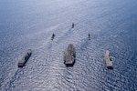 ADRIATIC SEA (May 31, 2022) The Nimitz-class aircraft carrier USS Harry S. Truman (CVN 75), back center, transits in formation with, from left to right, Spanish Navy multi-purpose amphibious assault ship-aircraft carrier ESPS Juan Carlos I (L-61), Spanish Navy F-100 class air defense frigate ESPS Almirante Juan De Borbón (F-102), Ticonderoga-class guided-missile cruiser USS San Jacinto (CG 56), Italian Navy Andrea Doria-class air defense destroyer ITS Andrea Doria (D-553) and Italian Navy Cavour-class aircraft carrier ITS Cavour (CVH 550) during NATO-led activity Neptune Shield 22 in the Adriatic Sea, May 31, 2022. Neptune Shield 22 is the natural evolution of NATO's ability to integrate the high-end maritime warfare capabilities of an Aircraft Carrier Strike Group, an Amphibious Ready Group and a Marine Expeditionary Unit to support the defense of the alliance. The Harry S. Truman Carrier Strike Group is on a scheduled deployment in the U.S. Naval Forces Europe area of operations, employed by U.S. Sixth Fleet to defend U.S., allied and partner interests.  (U.S. Navy photo by Mass Communication Specialist 3rd Class Crayton Agnew)