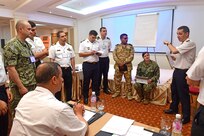 Cmdr. Jason Looper, Naval Reserve U.S. Naval Forces Europe-Africa N5 North Africa Training & Operations Director, facilitates a maritime legal information exchange to share best practices for maritime interdiction operations during exercise Phoenix Express 2022 in Tunis, Tunisia, May 26, 2022. Phoenix Express 22, conducted by U.S. Naval Forces Africa, is a maritime exercise designed to improve cooperation among participating nations in order to increase maritime safety and security in the Mediterranean.