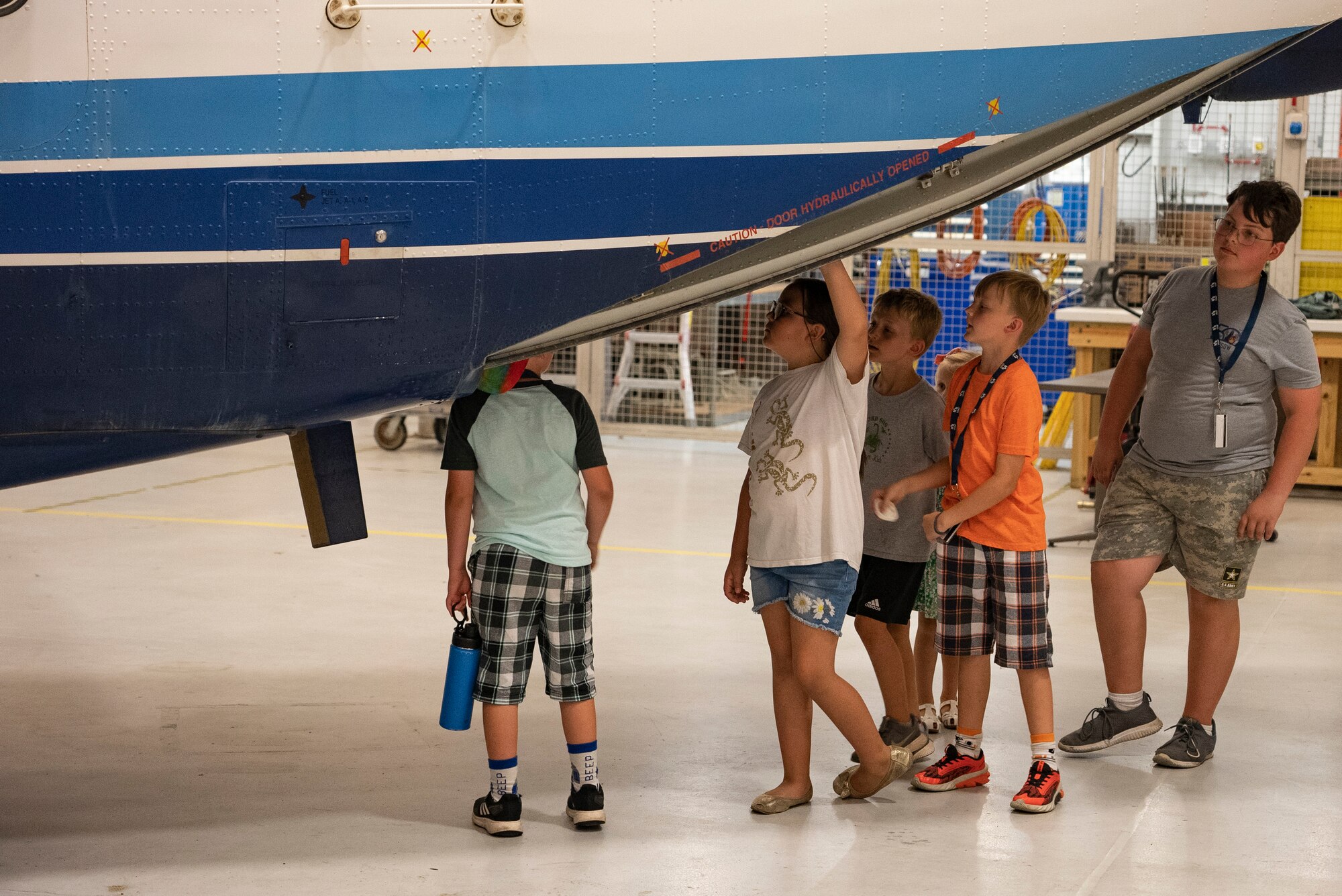 Children look in a parked aircraft