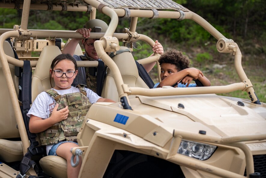 Children sitting in all-terrain vehicle