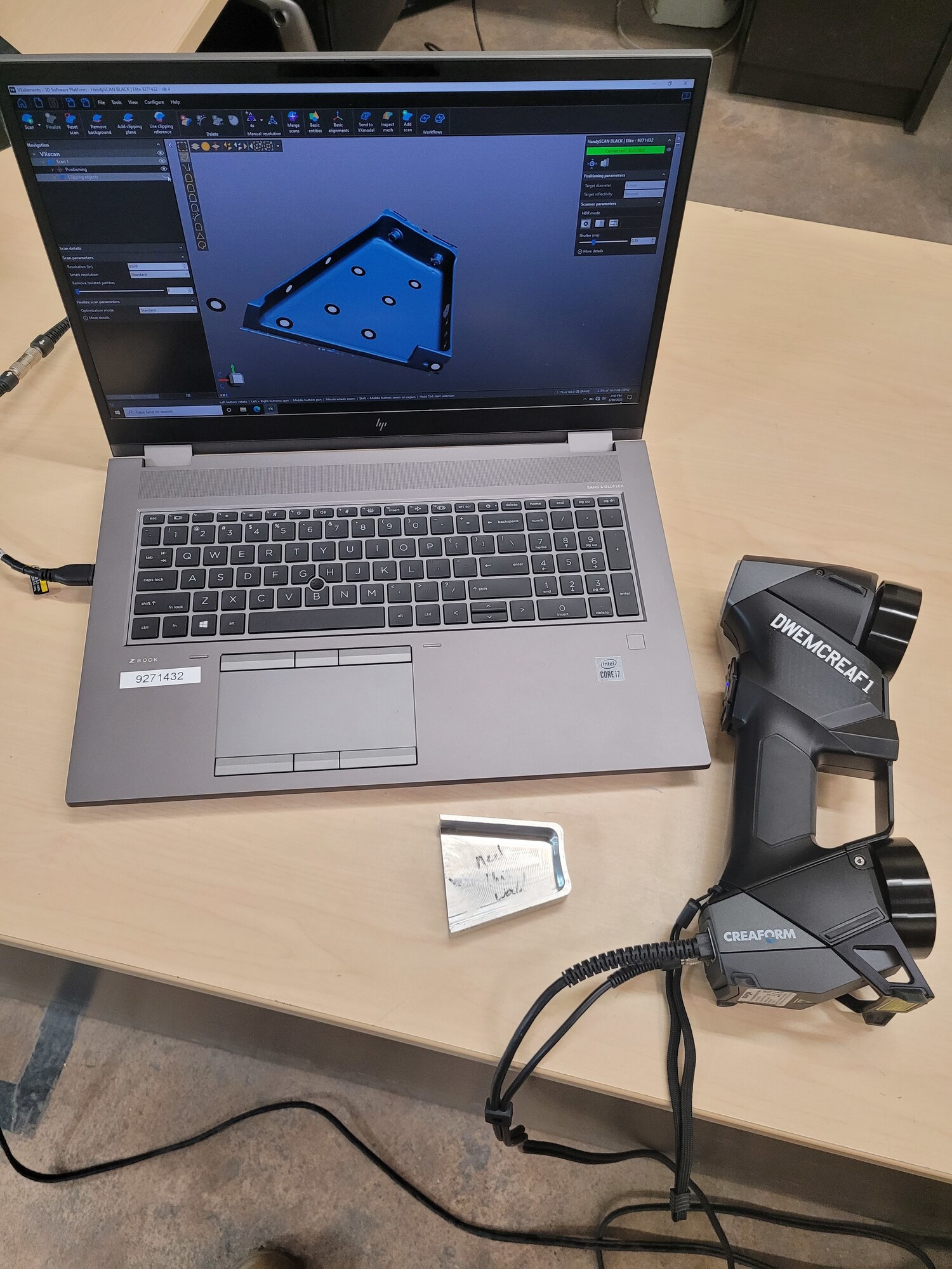 A small B-1B Lancer part fabricated by the 7th Equipment Maintenance Squadron Aircraft Metals Technology section sits next to the laptop that was part of creating it at Dyess Air Force Base, Texas. In early 2022, the section received a scanner, a laptop and an application that scans aircraft parts with total accuracy in order to fabricate the parts using new 3D printing technology. (Courtesy photo)