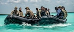 U.S. Marines with 3rd Force Reconnaissance Company, 4th Marine division, along with Colombian Marines and Mexican Marines, ride aboard combat rubber raiding crafts during exercise Tradewinds 2022, at Bacalar lagoon, Mexico, May 10, 2022. TW22 is a U.S. Southern Command-sponsored Caribbean-focused multi-dimensional exercise conducted in the ground, air, sea, and cyber domains, designed to provide participating nations opportunities to conduct joint, combined, and interagency training focused on increasing regional cooperation and interoperability in complex multinational security operations.