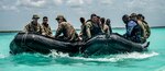 U.S. Marines with 3rd Force Reconnaissance Company, 4th Marine division, along with Colombian Marines and Mexican Marines, ride aboard combat rubber raiding crafts during exercise Tradewinds 2022, at Bacalar lagoon, Mexico, May 10, 2022. TW22 is a U.S. Southern Command-sponsored Caribbean-focused multi-dimensional exercise conducted in the ground, air, sea, and cyber domains, designed to provide participating nations opportunities to conduct joint, combined, and interagency training focused on increasing regional cooperation and interoperability in complex multinational security operations.