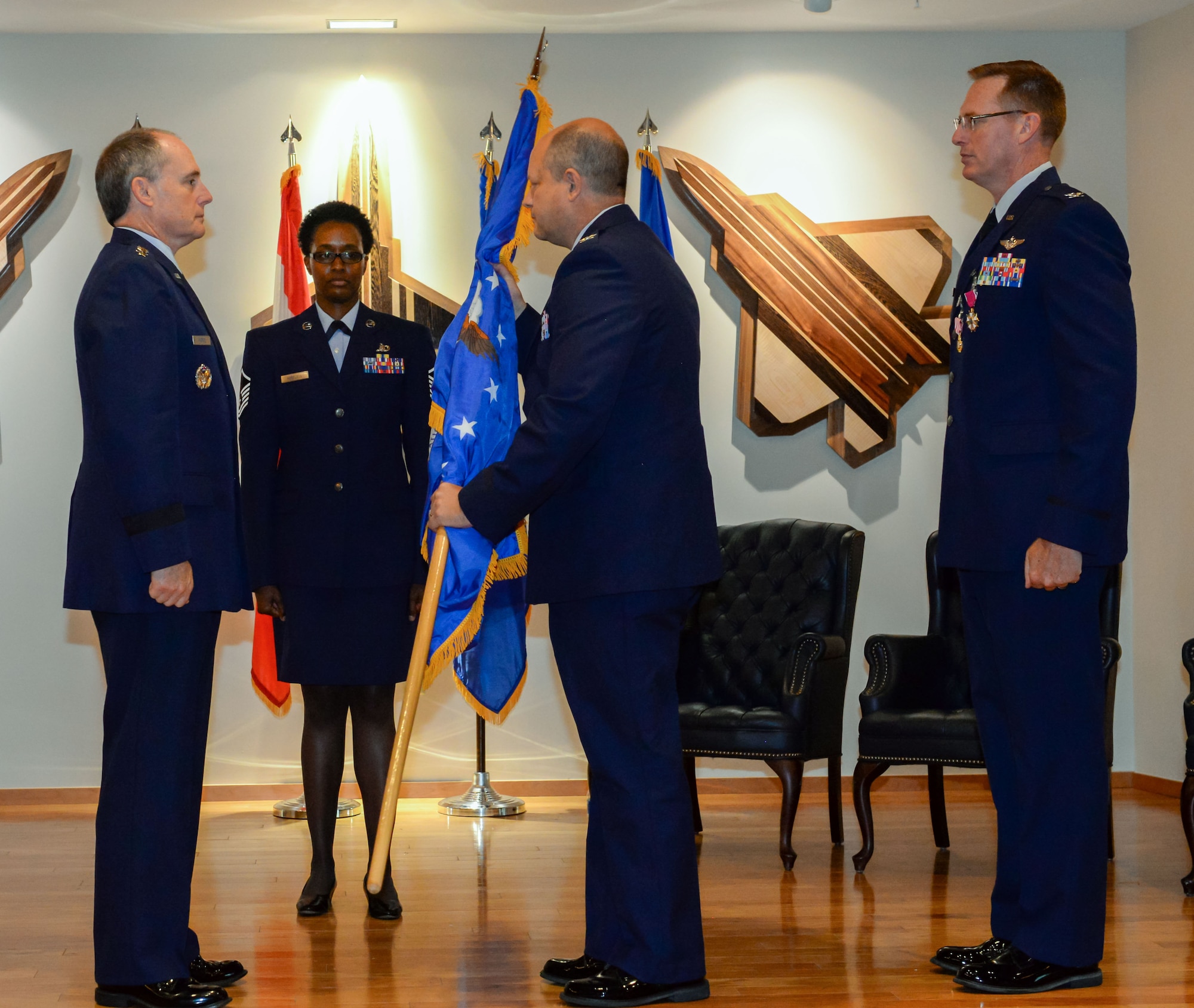 Col. Clayton Schaefer, 601st Air Operations Center commander, receives the ceremonial flag from Lt. Gen. Kirk Pierce, Continental U.S. North American Aerospace Defense Command Region – 1st Air Force (Air Forces Northern and Air Forces Space) commander, during the 601st AOC change of command ceremony at Tyndall Air Force Base, Florida on June 1, 2022.  The passing of the flag symbolizes Schaefer's acceptance of command of the 601st AOC. (Air National Guard photo by Master Sgt. Regina Young)