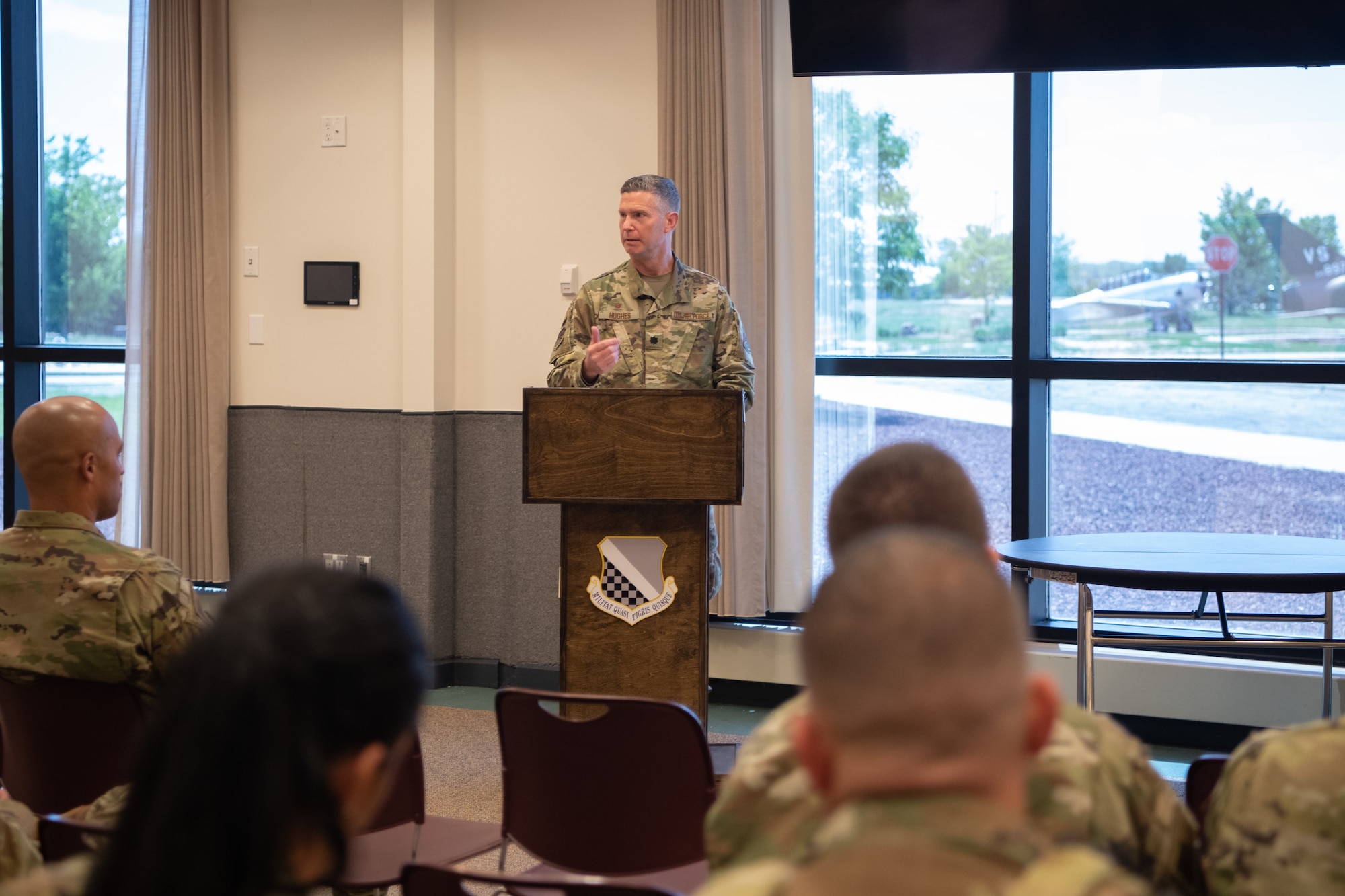 Lt. Col. Benjamin Hughes, 460th Healthcare Operations Squadron commander, takes a moment to recognize soon-to-be master sergeants during a promotion release ceremony June 2, 2022 at Buckley Space Force Base, Colo.