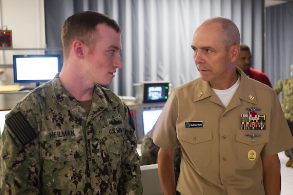 DAHLGREN, Va. (June 01, 2022) Naval Education and Training Command's (NETC) Force Master Chief Matthew Harris recognizes AEGIS Tactical Action Officer Baseline 5.4 class advisor and leading instructor, Operations Specialist 1st Class Russel Heilman, for his achievements during his visit to Surface Combat Systems Training Command (SCSTC) AEGIS Training and Readiness Center (ATRC) onboard Naval Support Facility (NSF) Dahlgren. (U.S. Navy photo by Michael Bova)