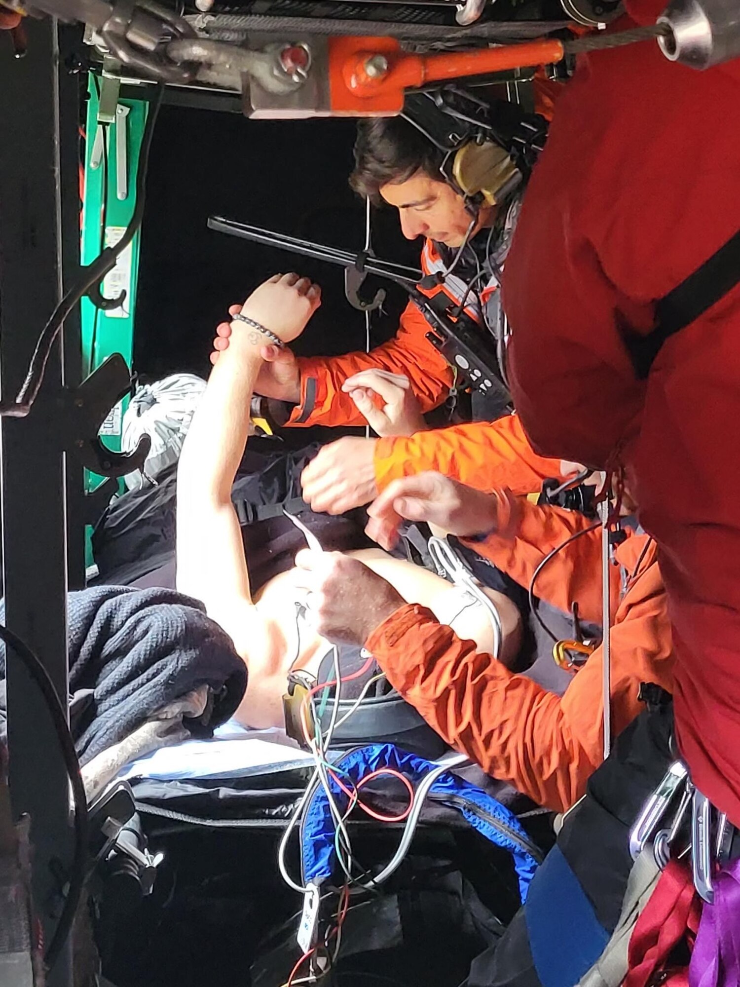 304th Rescue Squadron pararescuemen provide medical assistance to a recovered climber May 13, 2022 on Mount Rainier, Washington. The 304th RQS  assisted in saving two stranded climbers from the mountain. (Courtesy photo)