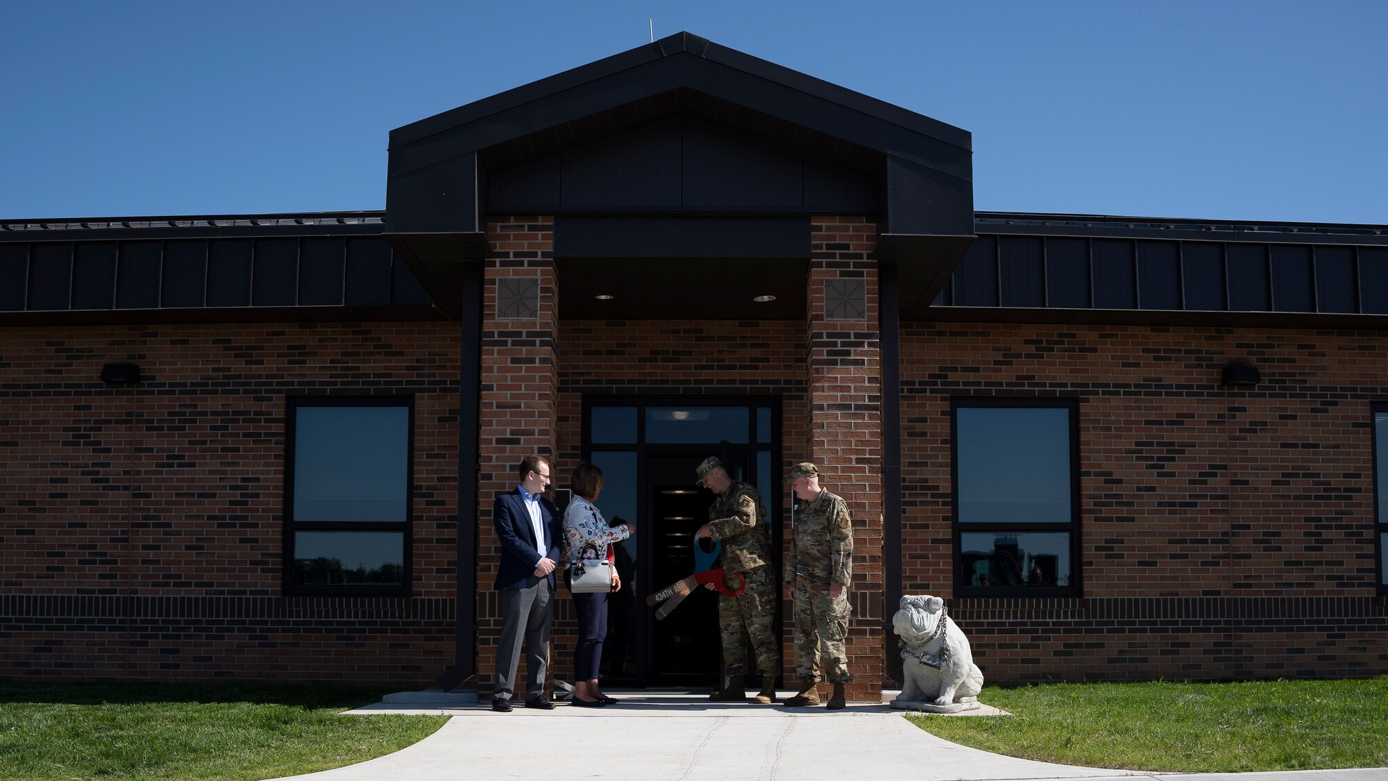 Griffin Nate, field representative for Congresswoman Jackie Walorski, Indiana State Sen. Stacey Donato, 49th Aerial Port Squadron Commander Maj. Jefre Potterbaum, and 434th Air Refueling Wing Commander Col. Thom Pemberton cut the ribbon outside of Aerial Port’s new facility, officially marking the opening of the building at Grissom Air Reserve Base, Indiana on 3 June, 2022. The new 11,870 square-foot facility will give aerial porters their own dedicated space to process air cargo, load and unload aircraft and perform joint inspections of cargo and equipment used for air transportation. (U.S. Air Force photo by Tech. Sgt. Josh Weaver)