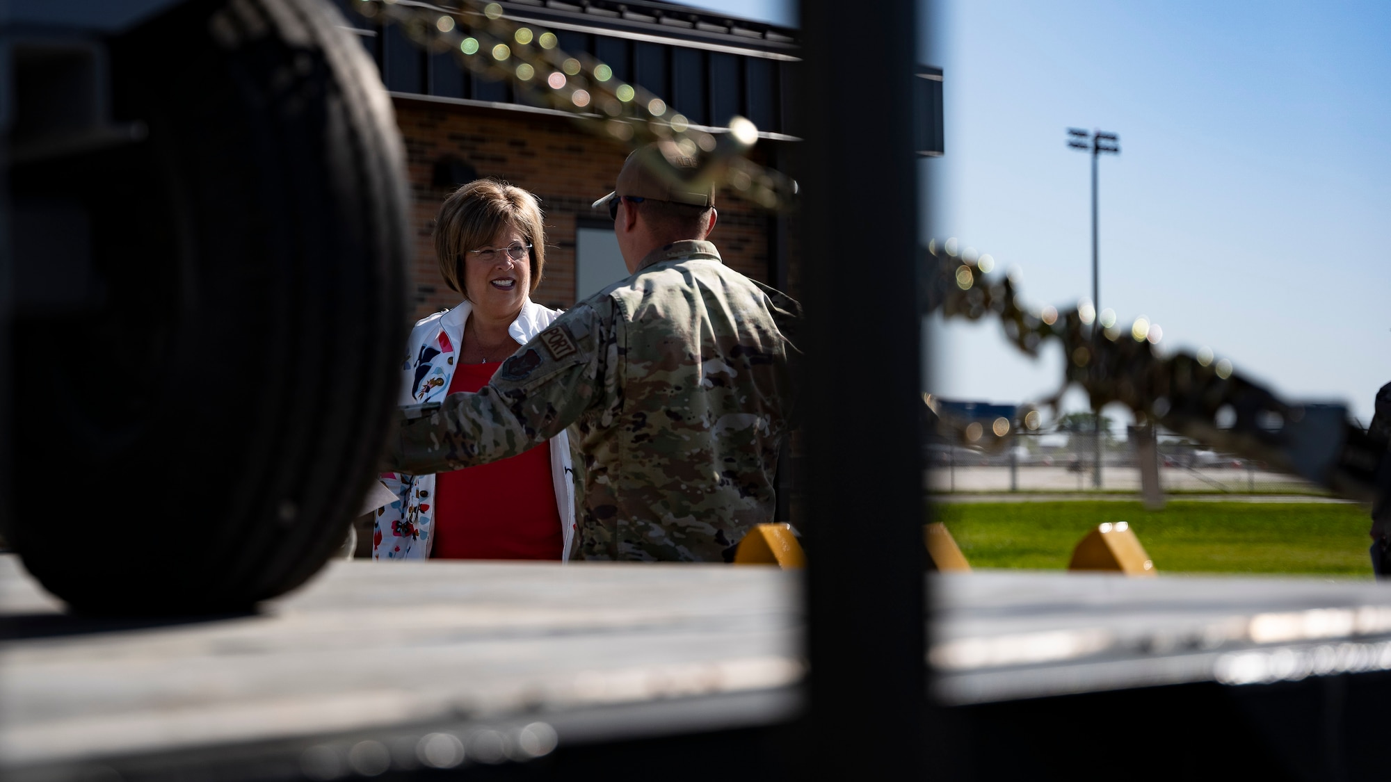 Staff Sgt. Joshua Alter, 49th Aerial Port Squadron, aerial port apprentice highlights some the squadrons equipment to Indiana State Sen. Stacey Donato at a ribbon cutting ceremony for the 49th APS new facility at Grissom Air Reserve Base, Indiana on 3 June, 2022. The new 11,870 square-foot facility will give aerial porters their own dedicated space to process air cargo, load and unload aircraft and perform joint inspections of cargo and equipment used for air transportation. (U.S. Air Force photo by Tech. Sgt. Josh Weaver)