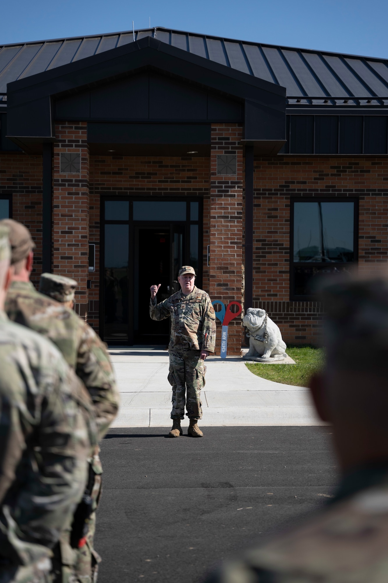 Col. Thom Pemberton 434th Air Refueling Wing commander speaks speaks to Airmen assigned to the 49th Aerial Squadron, welcoming them to their new building at Grissom Air Reserve Base, Indiana on 3 June, 2022. The new 11,870 sguare-foot facility will give aerial porters their own dedicated space to process air cargo, load and unload aircraft and perform joint inspections of cargo and equipment used for air transportation. (U.S. Air Force photo by Tech Sgt. Josh Weaver)