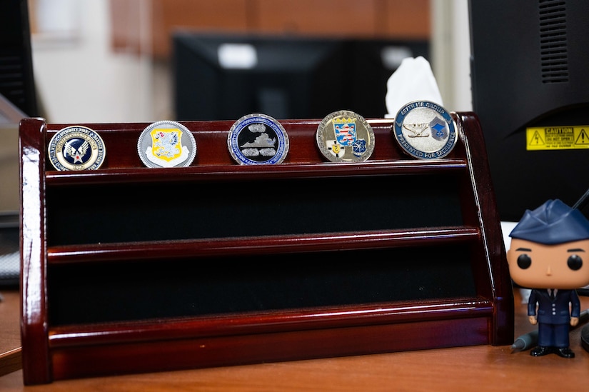 U.S. Air Force Airman 1st Class Patrick Mulligan has received many challenge coins during his assignment at Joint Base Langley-Eustis. Mulligan has been recognized for excellence during the course of his duties with the 633rd Force Support Squadron and helping members transition out of the military. (U.S. Air Force photo by Senior Airman Johnny Foister)
