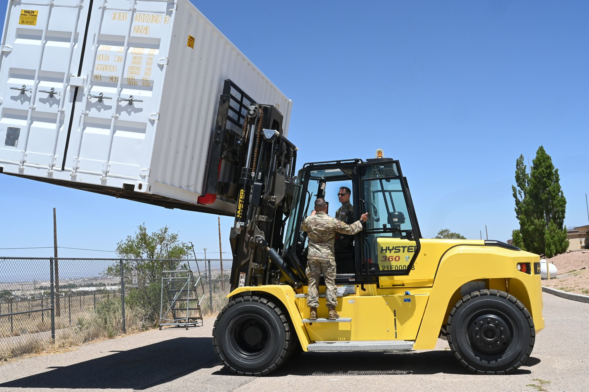 A man operates a forklift.