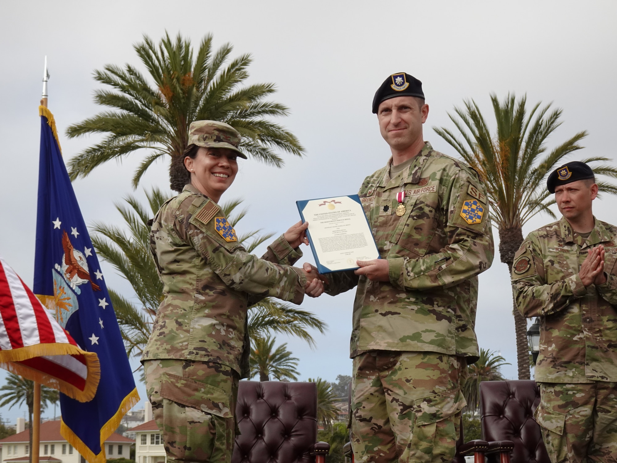 Lieutenant Colonel Nicholas Brence, 61 SFS commander, right, received the Meritorious Service Medal, second oak leaf cluster, from Col. Becky Beers, Los Angeles Garrison commander, left, during his change of command ceremony held on June 1 at Fort MacArthur. He was recognized for several accomplishments including his leadership of the squadron which was recognized as the 2021 United States Space Force’s Outstanding Small Security Forces unit.