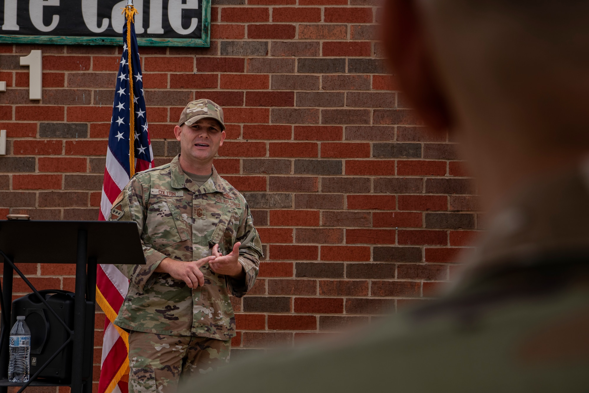 Chief Master Sgt. Matthew Coltrin, 7th Bomb Wing command chief, speaks during the grand re-opening of the Soul Fire Café at Dyess Air Force Base, Texas, June 3, 2022. The Soul Fire Café has been equipped with new lighting, games and paint to improve the quality of life for the Airmen of America's lift and strike base. (U.S. Air Force photo by Airman 1st Class Ryan Hayman)