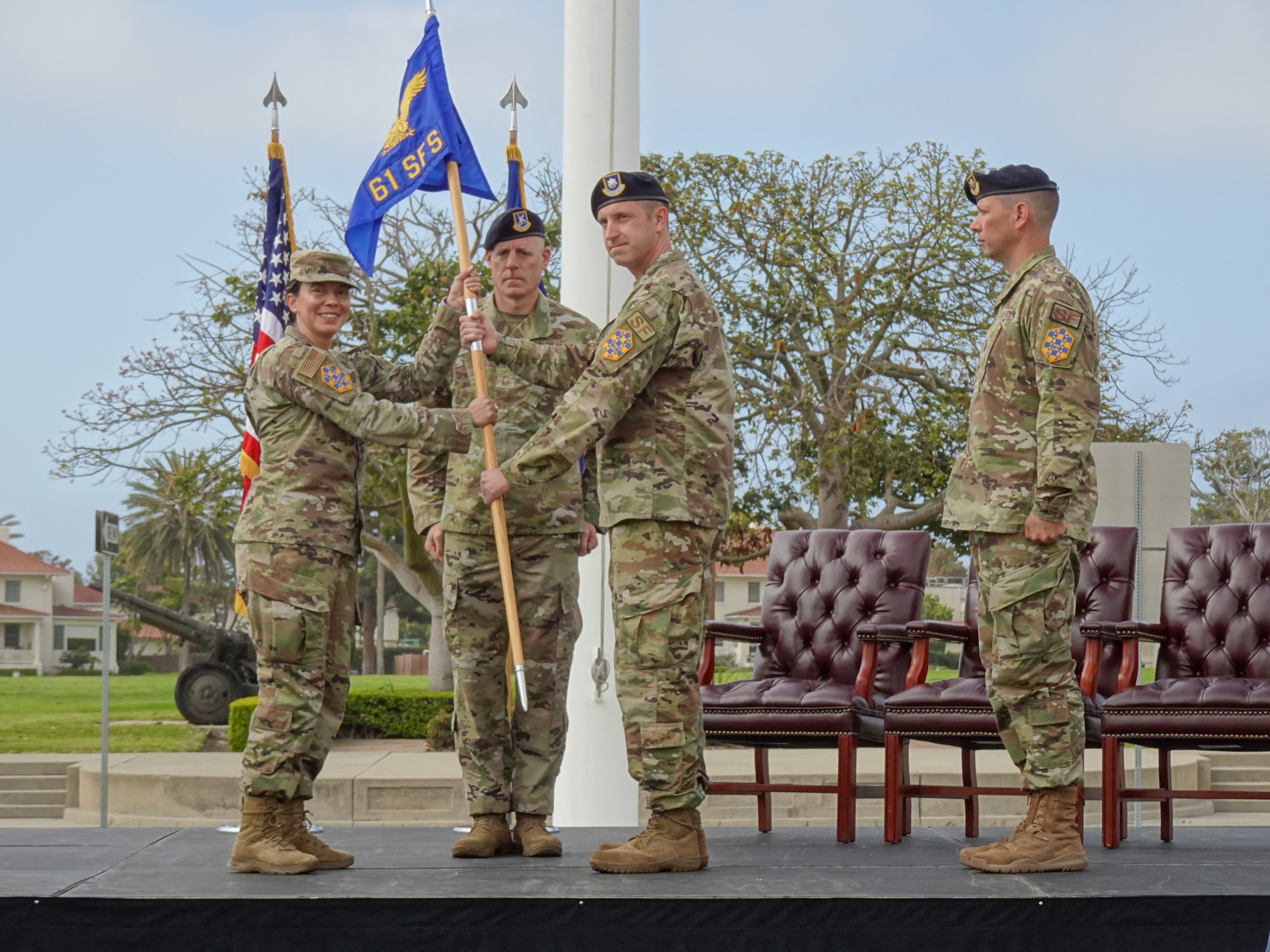 Col. Becky Beers, Los Angeles Garrison commander, left, accepts the 61st SFS, Security Forces Squadron, unit gideon from outgoing commander Lt. Col. Nicholas Brence, right, at his change of command ceremony which was held June 1 at Fort MacArthur. Chief Master Sgt. Michael Groder, 61st SFS senior enlisted leader, stands ready to post the gideon. He was recognized for several accomplishments including his leadership of the squadron which was recognized as the 2021 United States Space Force’s Outstanding Small Security Forces unit.